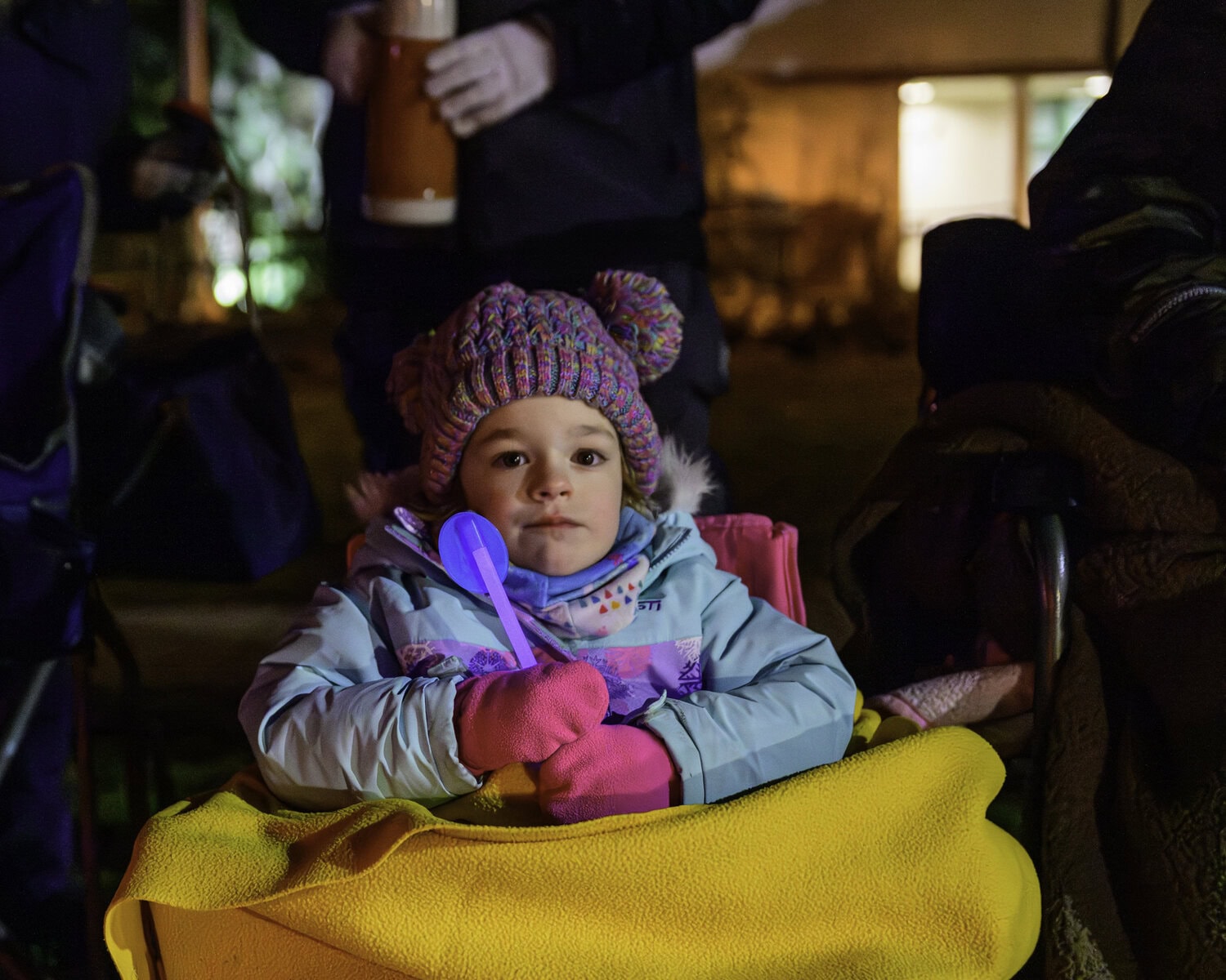 Three-year-old Lake Ackland is bundled up nice and warm to watch the parade.