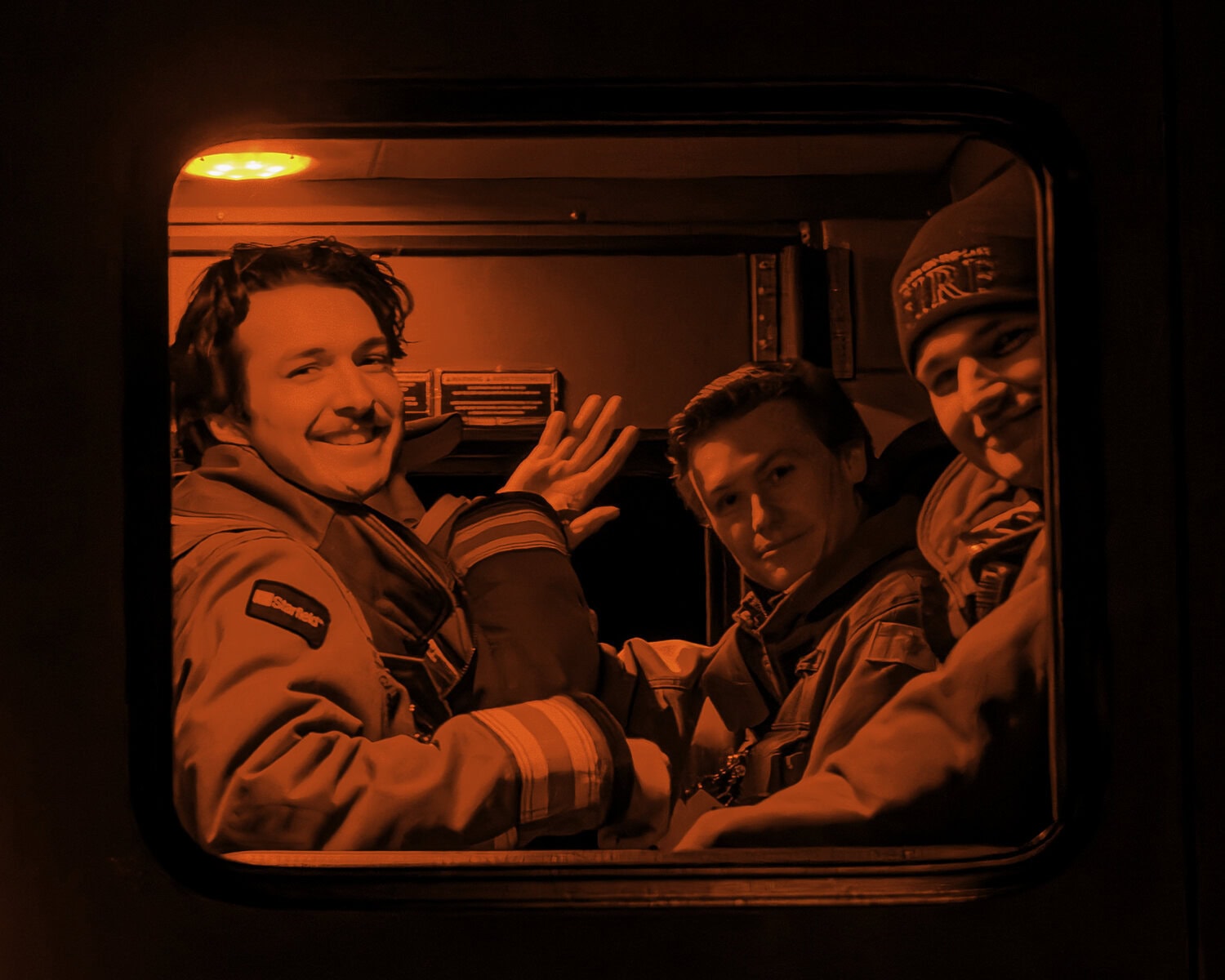 These Niagara-on-the-Lake Fire & Emergency Services volunteers give a smile and a wave from inside of their truck as the parade readies to go.