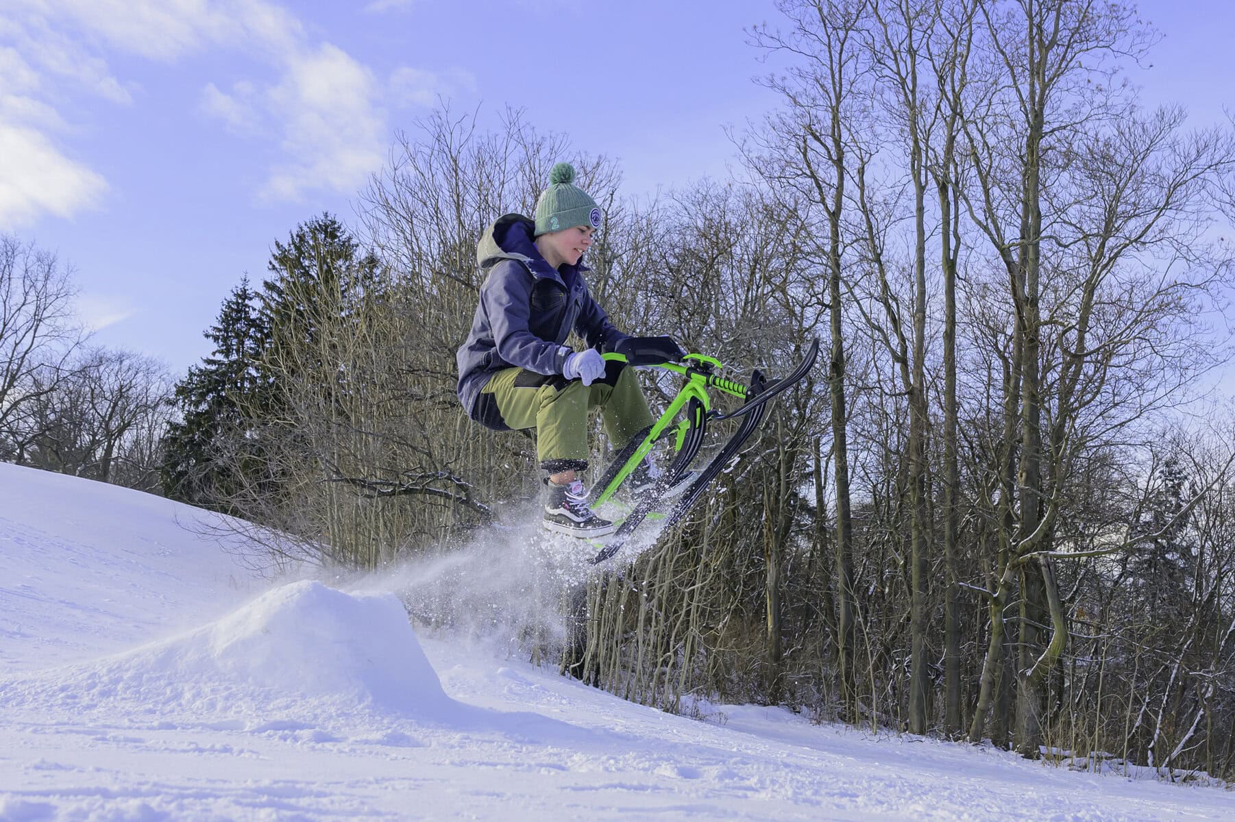 Aaron McInerney catches some air as he jumps off a ramp of snow at Fort George.