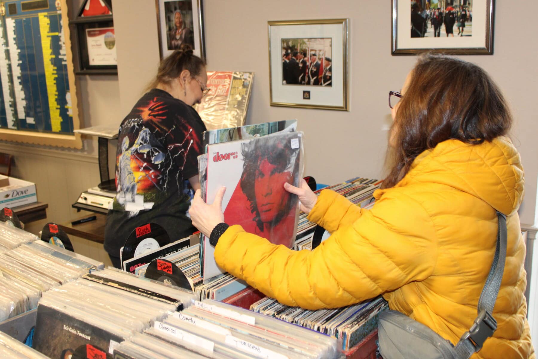 This customer eyes a copy of the Doors' "Greatest Hits" album — a good pick for fans of the '60s psychedelic rock band, or those looking to get into them.