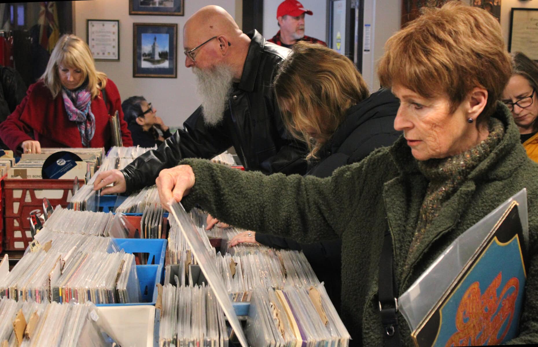 Customers flip through vinyls at the Branch 124 Record Show on Sunday.