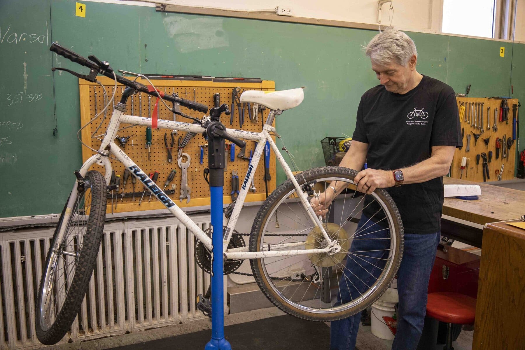 After a story in The Lake Report lets the community know that Bikes for Farmworkers desperately needs bicycles to refurbish for seasonal workers, dozens of two-wheelers roll into the old Virgil public school to fulfil the need.