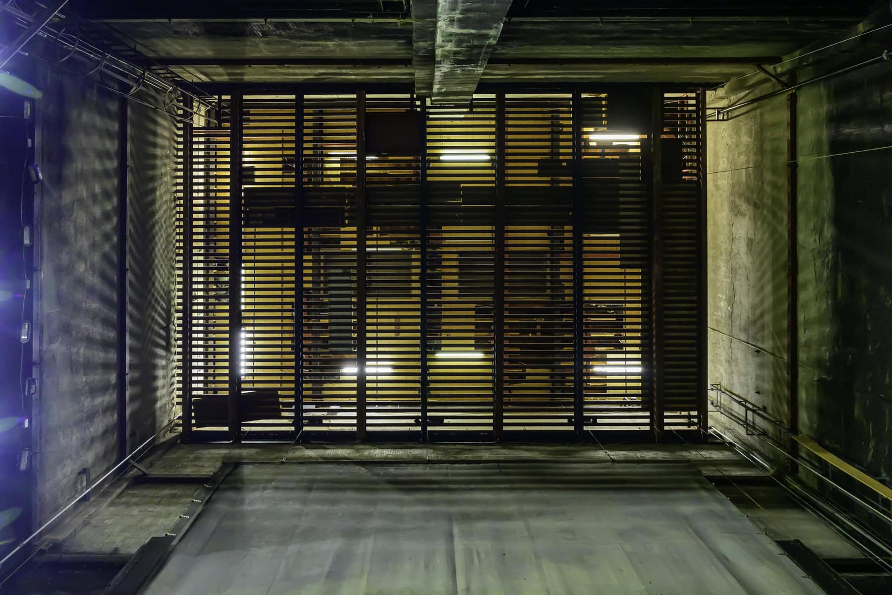 Up above the stage of the Royal George, its gridiron is where blocks, pulleys, lighting positions and flown scenery were rigged. Bill Talbot, the building's electrician for more than 40 years, says the steel grid was mistakenly installed with the chanels running the wrong direction, which has limited where equipment could be placed.