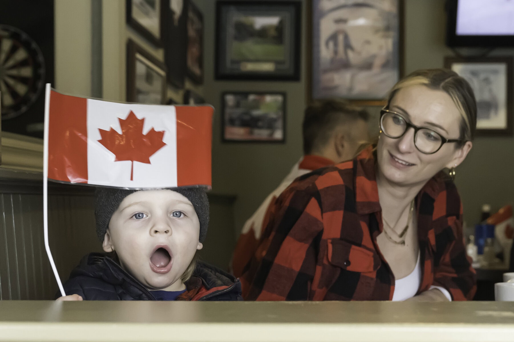 Among many of Team Canada's young fans, two-year-old Ted Ball cheers on his home country, with mom, Sarah Ball, by his side.