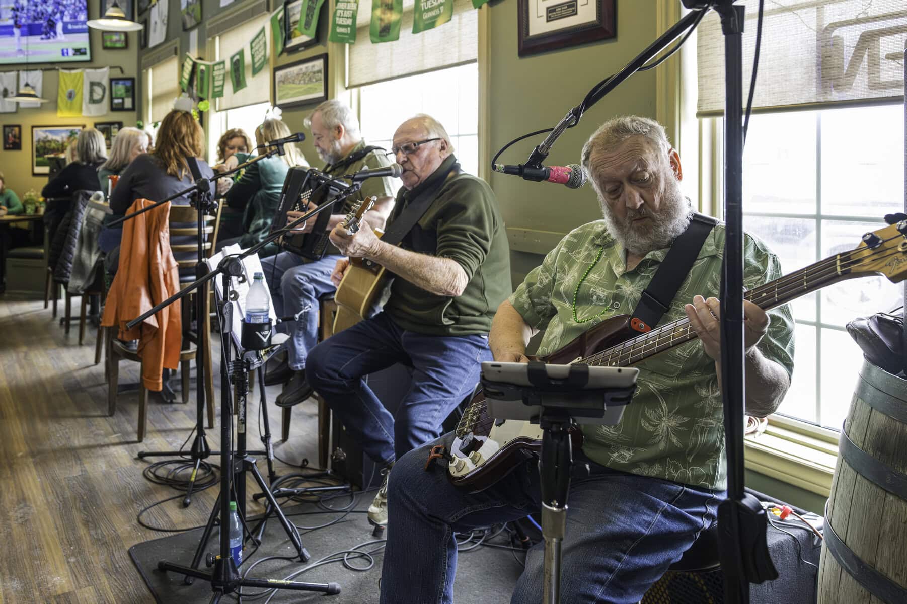 Members of the band
Barley Brae perform traditional Irish music for a packed house at the Sandtrap on
Tuesday. Patrons decked out in green attire and hats gathered to celebrate St. Patrick’s
Day with live entertainment, food, and drinks.