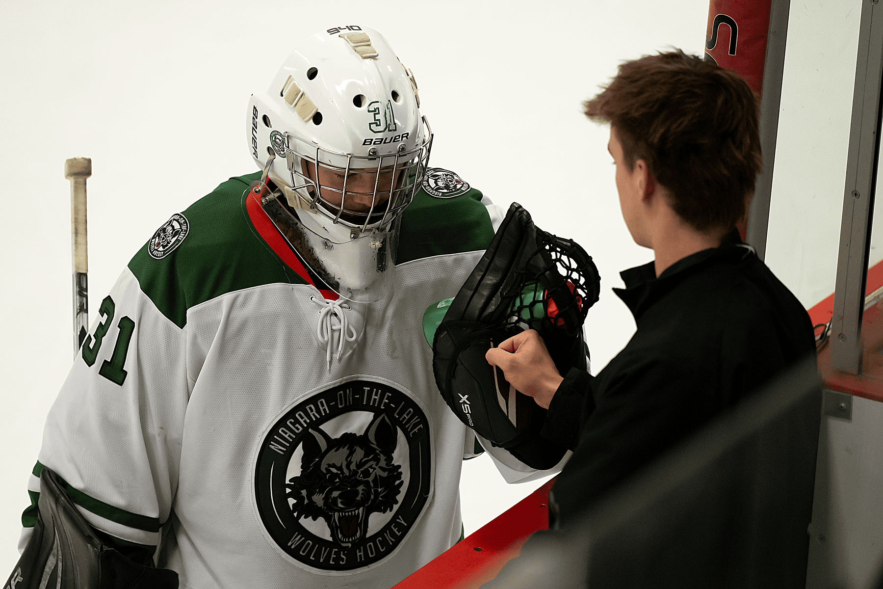 A fist bump for goaltender Tomas Nolan (31).