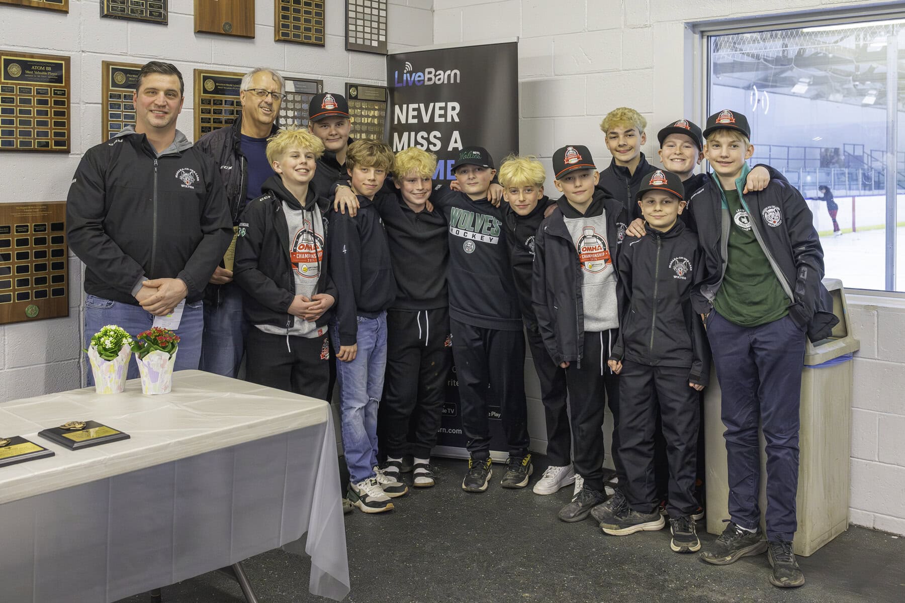 Coaches Gary Friesen, left, and Craig Slack with players from the U13 rep team celebrate Slack's Volunteer of the Year award. 
