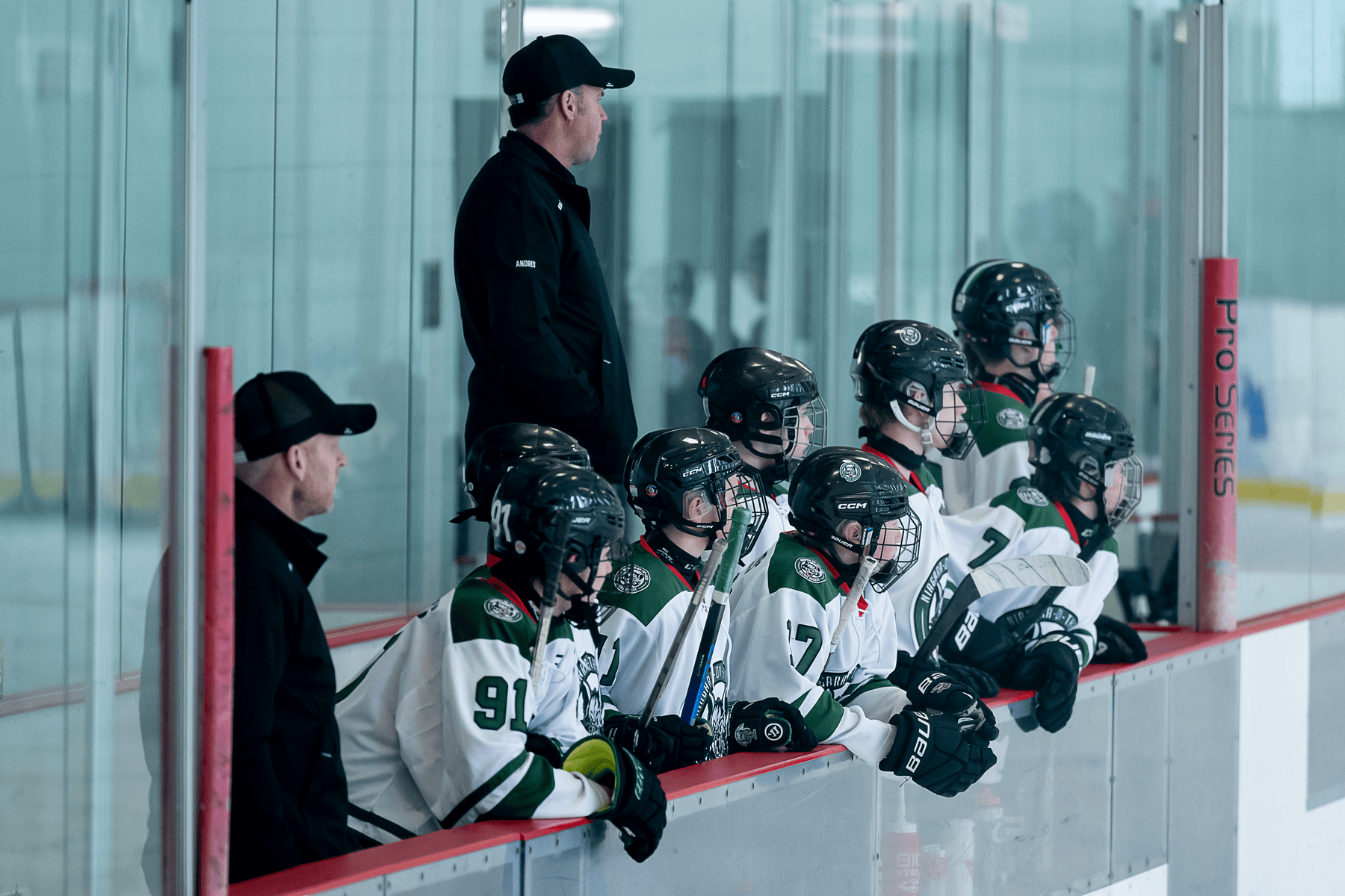 Players and coaches keep a keen on the play.