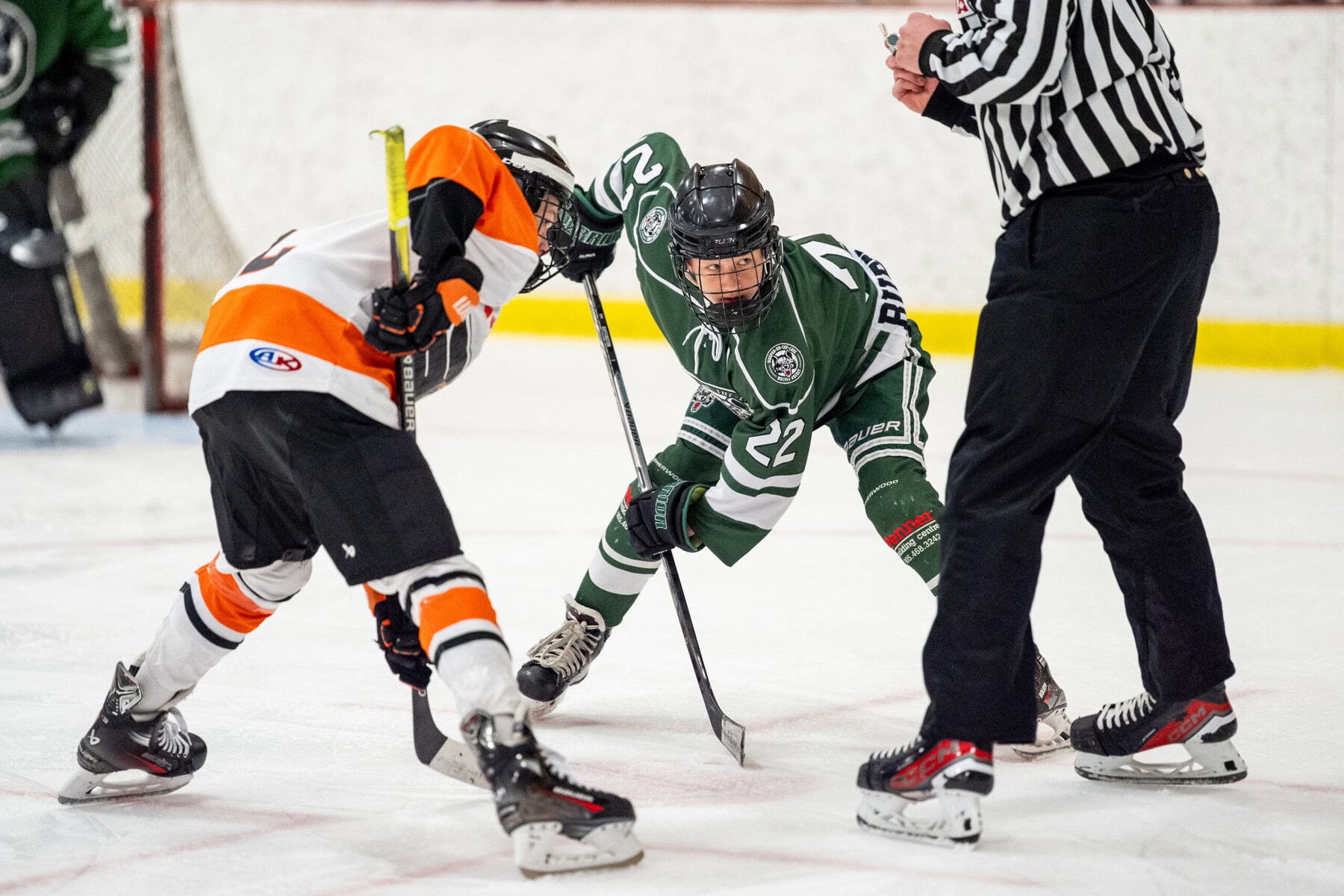 NOTL centre Henry Buffington (22) takes a faceoff during the semifinal against Frontenac.
