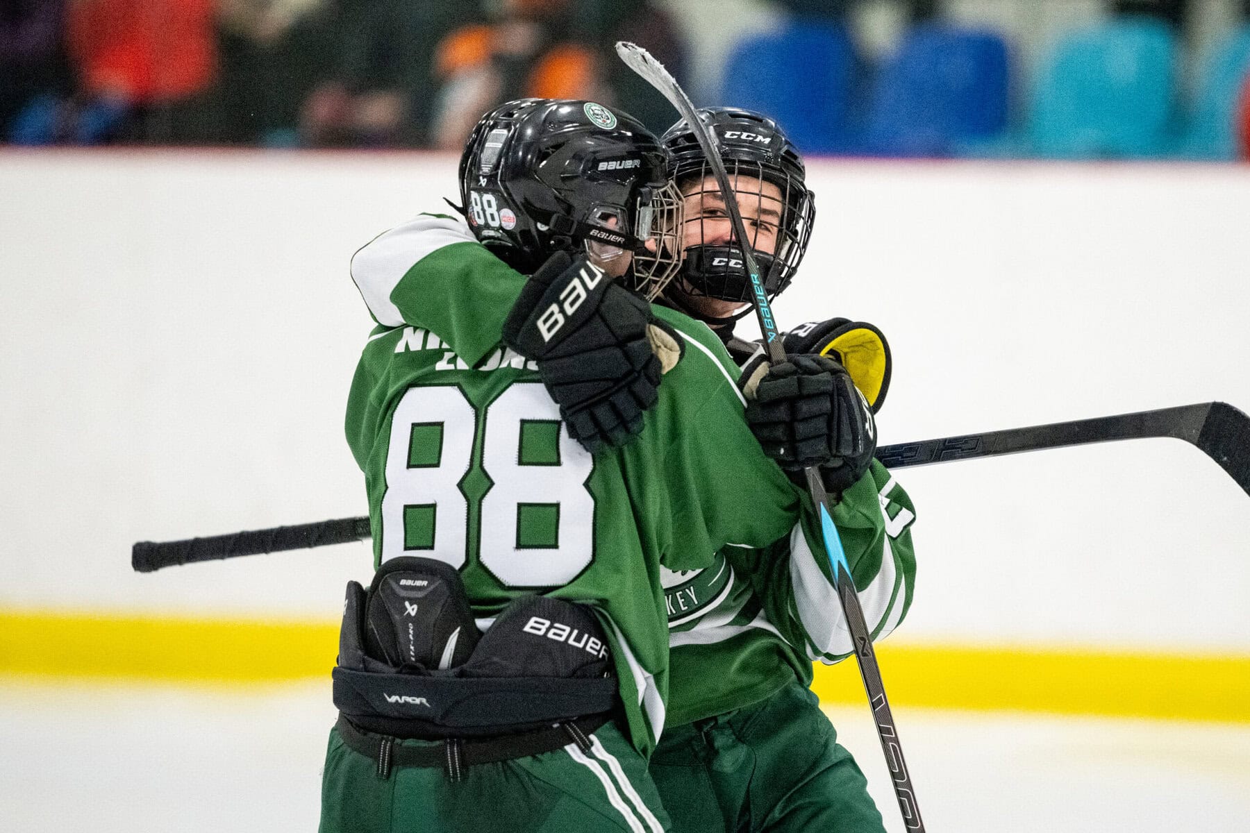 Lucas Woods (88) and Dean Olsen celebrate during their semifinal against Frontenac.