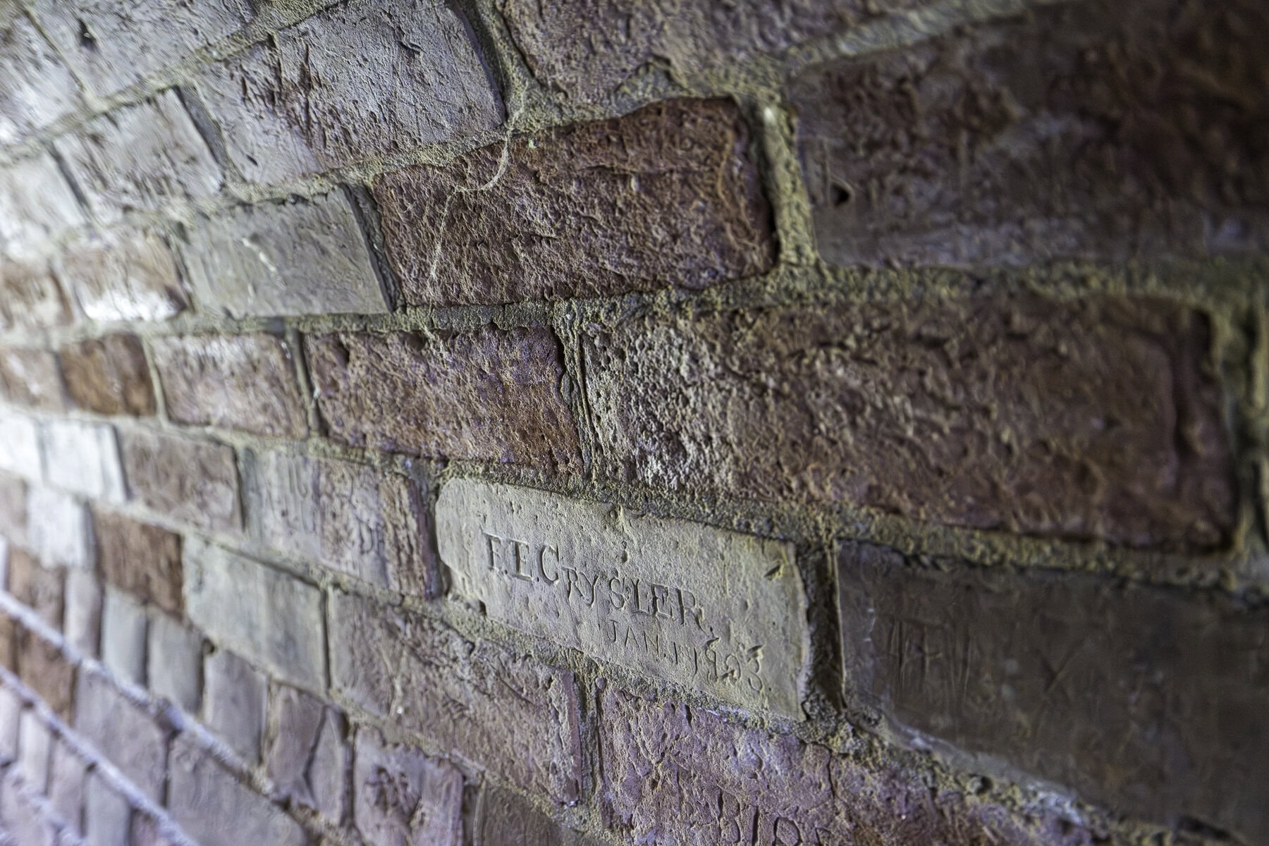 Inside the Sally Port, visitors can see the names of soldiers which were carved onto the stones long ago. This carving appears to be from January 1903.