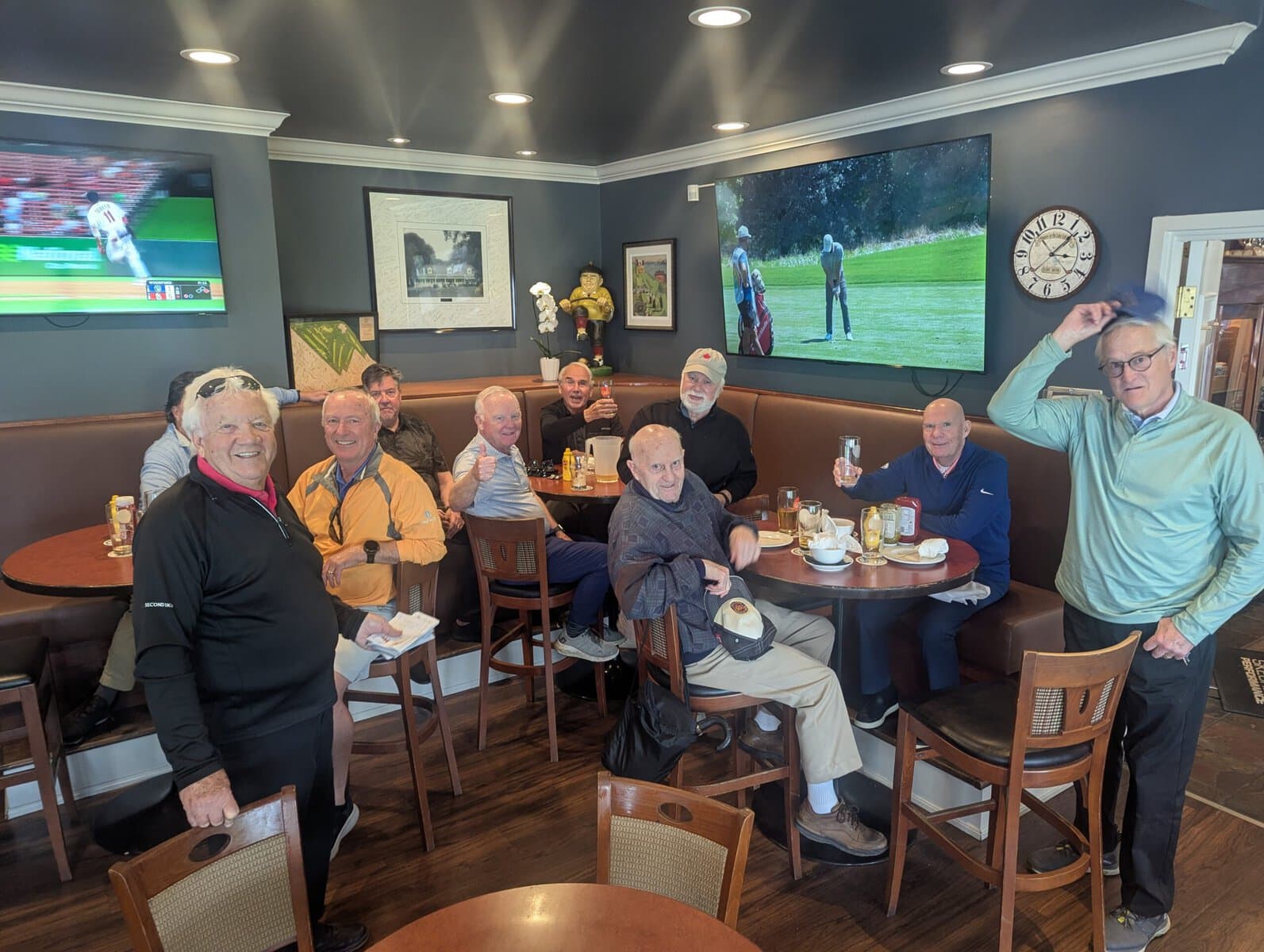 League organizer Bill Katrynuk, front left, and some of the players from the Tuesday Woofs league celebrated after their opening scramble this week. 