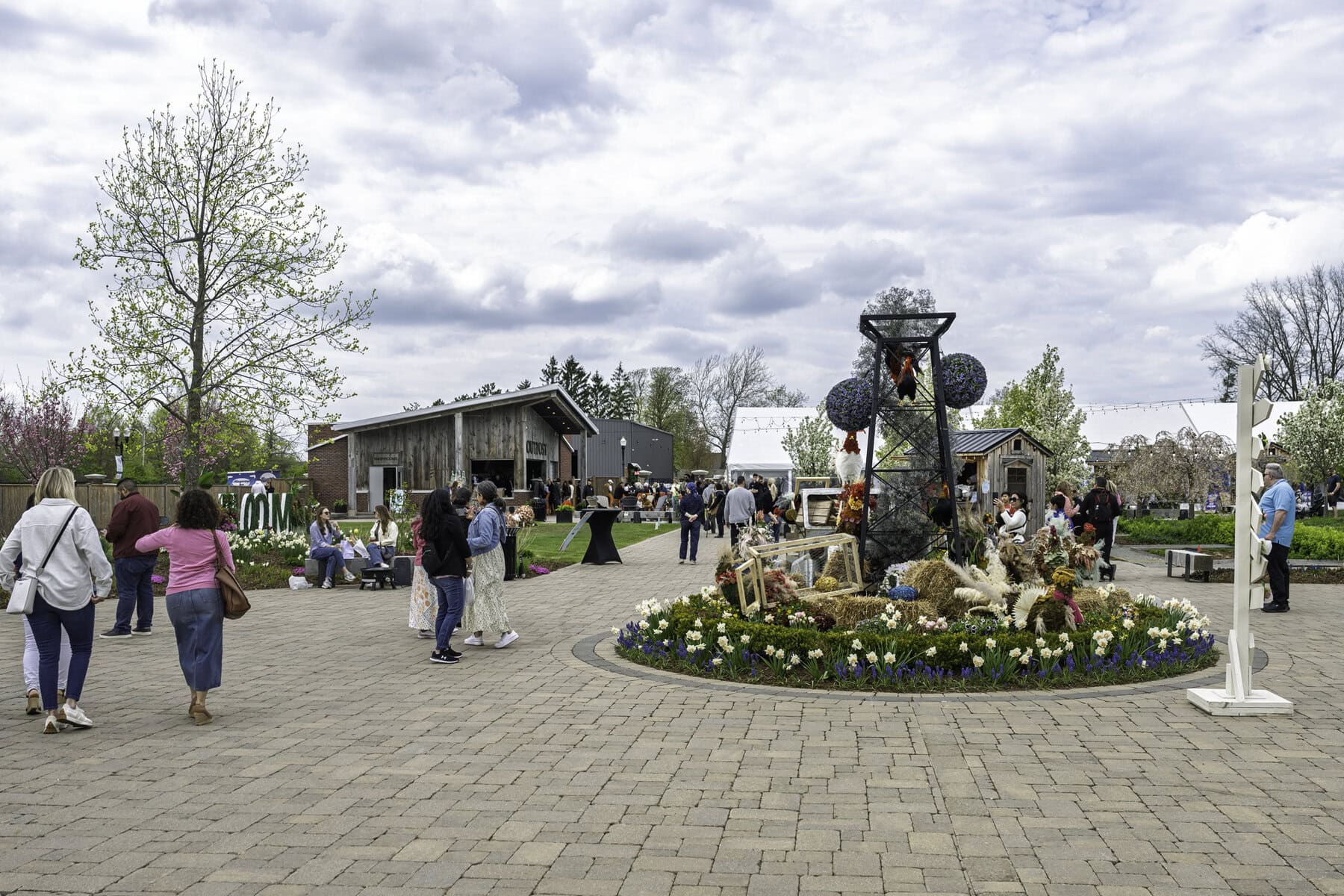 At the Pillar and Post's Gardens, these chickens may have flown the coop: this display by Clipping's Floral Design depicts a toppled truck spilling over with hens, chicks, hay and crates. It just goes to show you: don't count your chickens before they hatch.