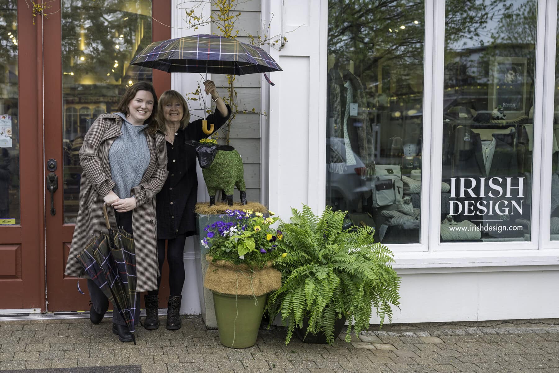 The Irish Design's small and charming sheep hedge outside its shop on Queen Street reminds you where all that wonderful wool that makes their Irish knit sweaters possible comes from: Shauna and Maureen Dixon, the owners of the shop, are all smiles next to their new friend.