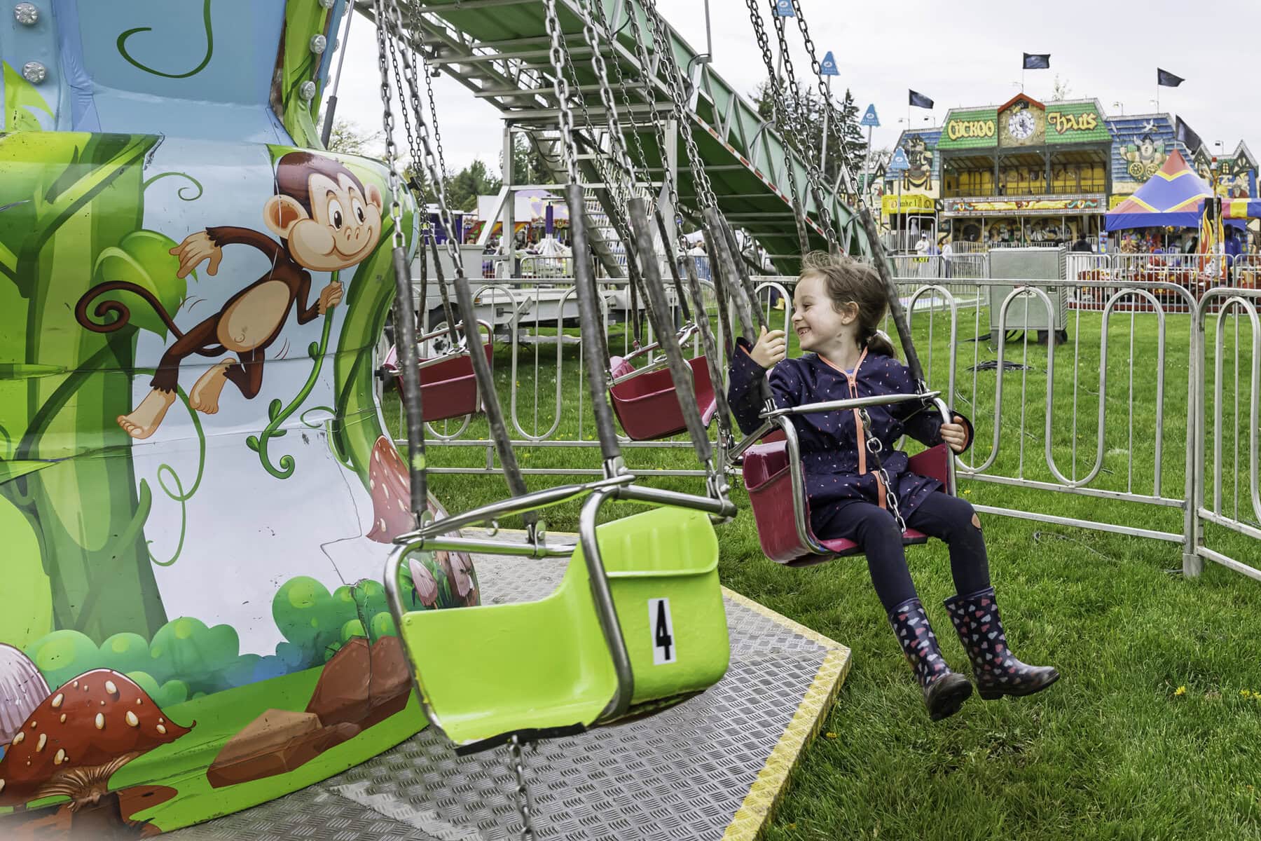 Six-year-old Gwendalyn Marquardt, meanwhile, gets into the swing of things on this ride.