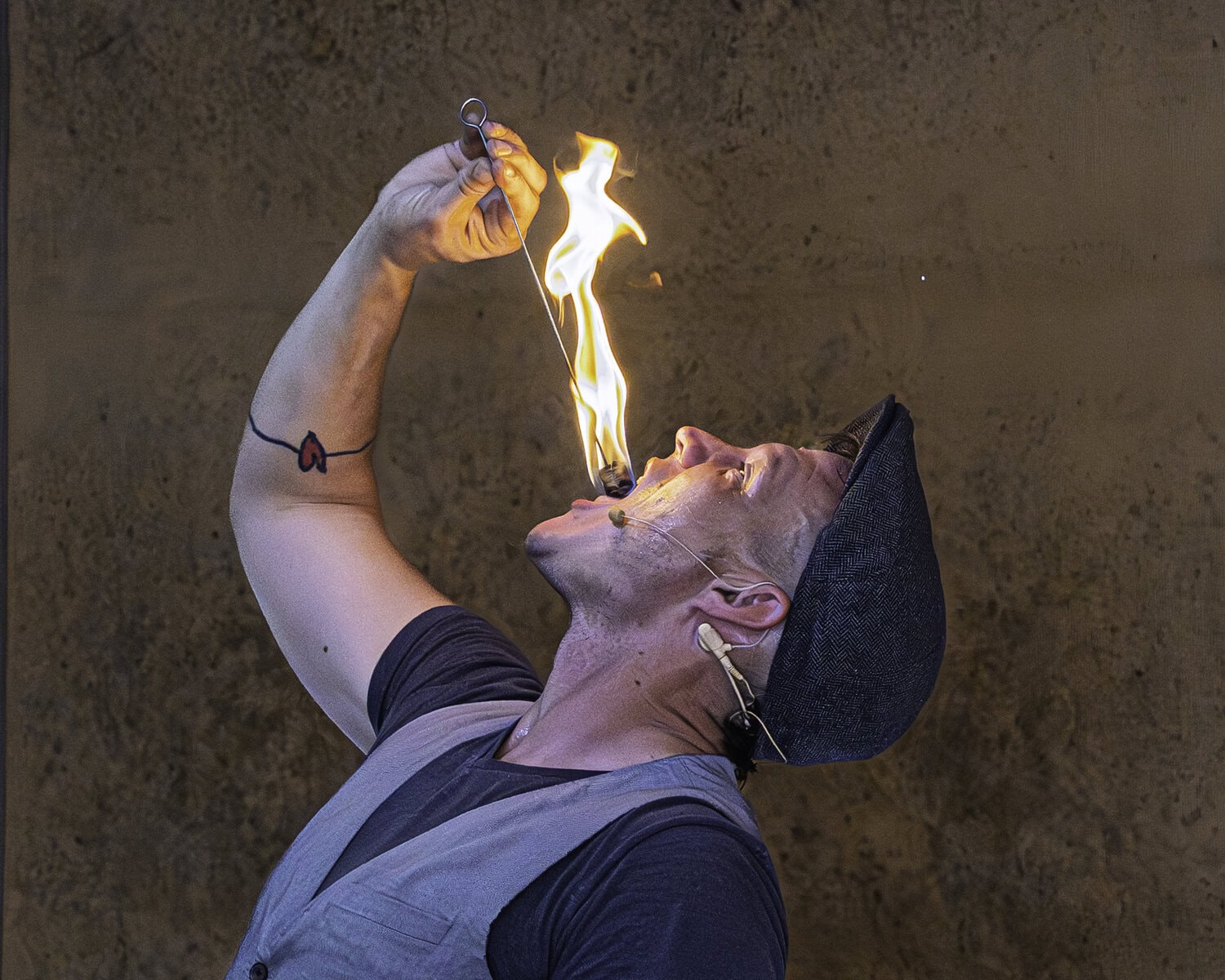 One of many entertainers on the fairgrounds, Kobbler Jay demonstrates his fire-eating abilities.