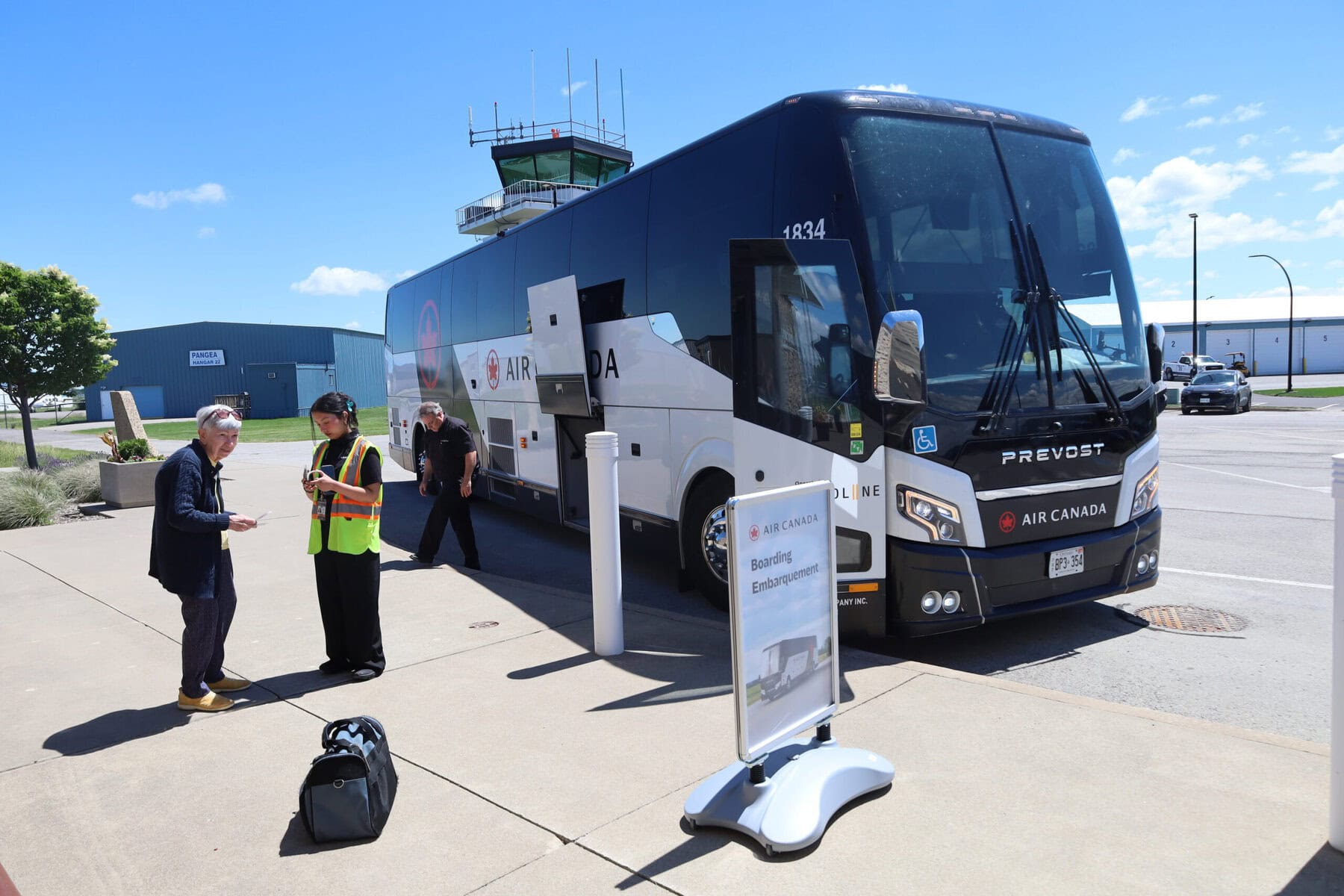 Passengers board an Air Canada bus at Niagara District Airport on Monday as Niagara’s new Landline connection to Pearson gets rolling.