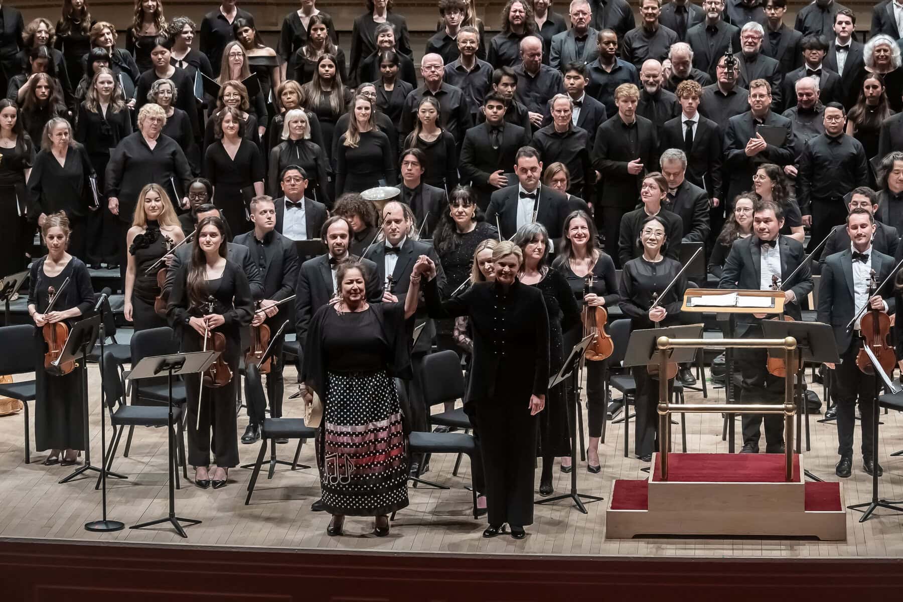 Indigenous composer and performer Sherryl Sewepagaham joins conductor Kathleen Allan and members of the orchestra and chorus on stage at Carnegie Hall. 