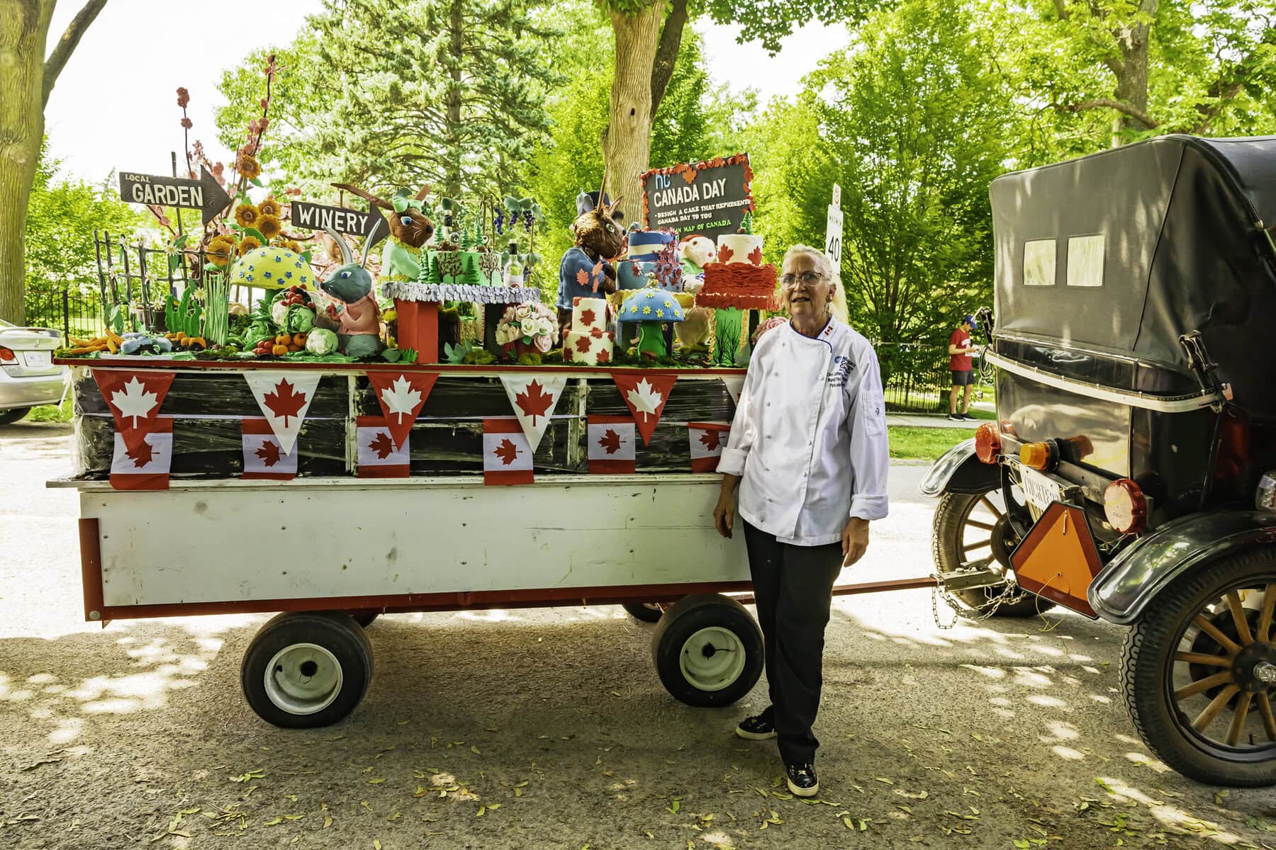 Chef Catherine O’Donnell stands beside one of her many Canada Day cakes. For years, she has
laboured to create the epic cakes that feed thousands for free at Simcoe Park.