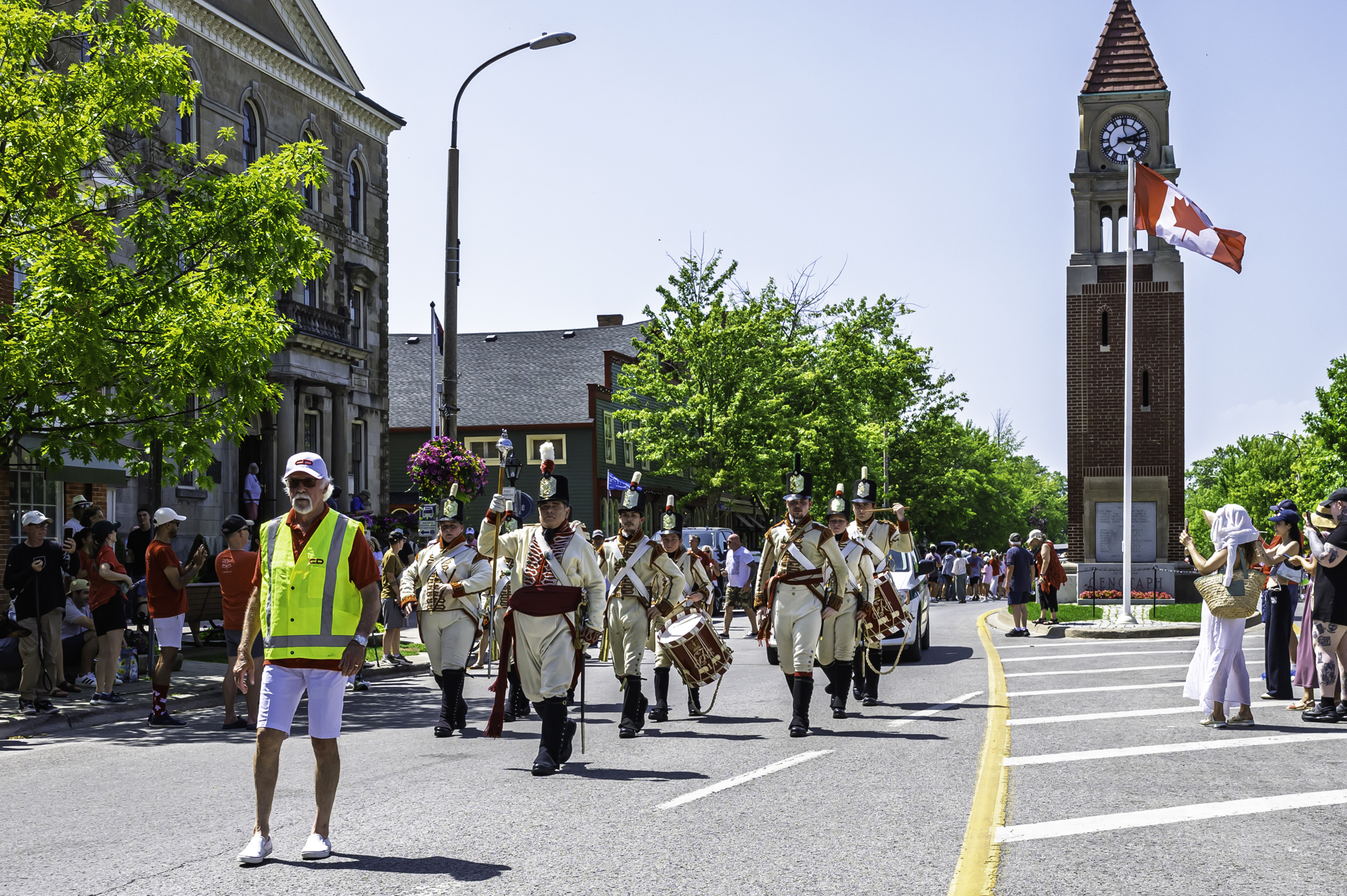 The Canadian flag stands tall and proud in downtown Old Town as Canada Day paradegoers make their promenade through the main strip of Niagara-on-the-Lake.