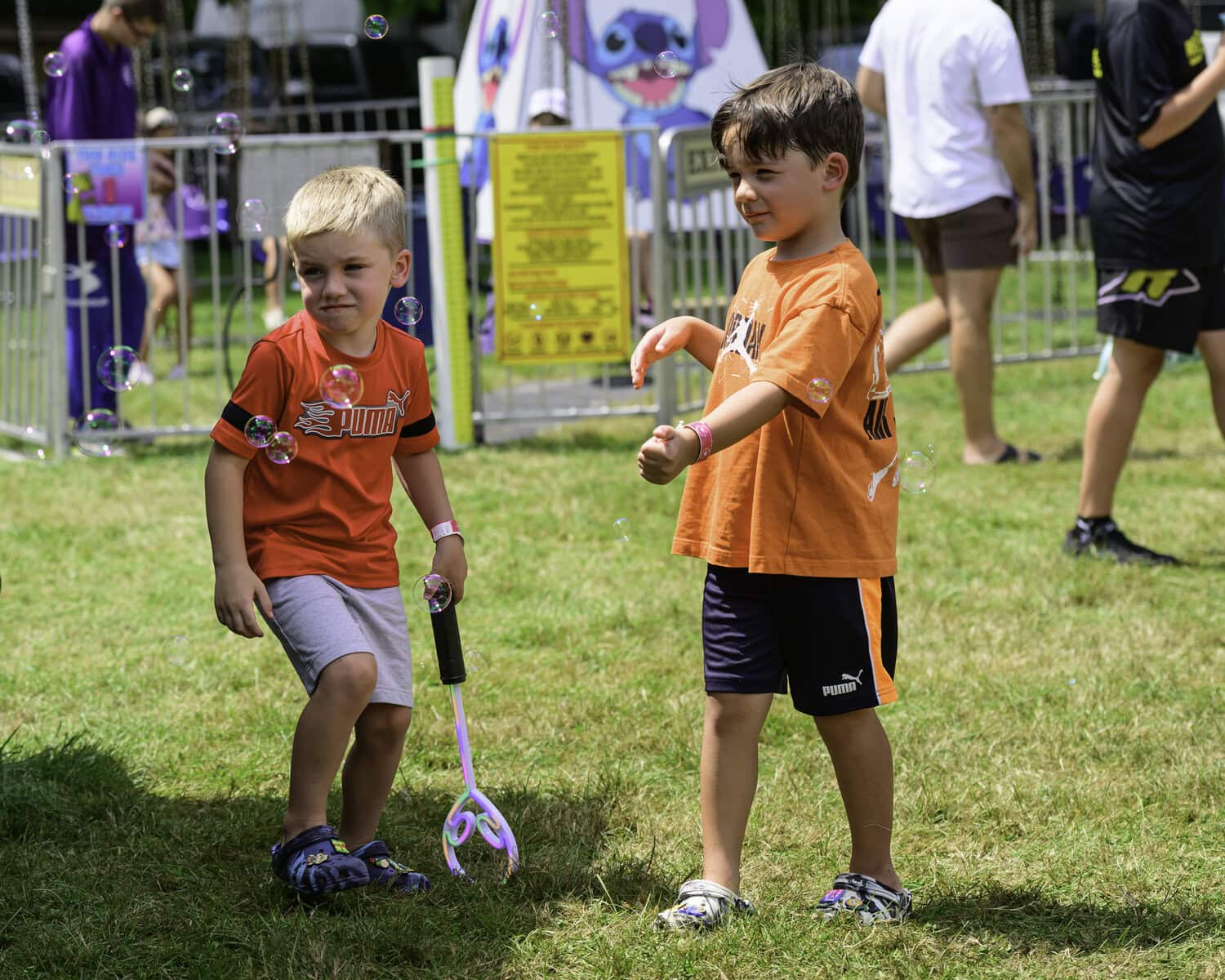 Jaxon Collin, 4, and Nash Collin, 5, have some fun over at the bubble machine.