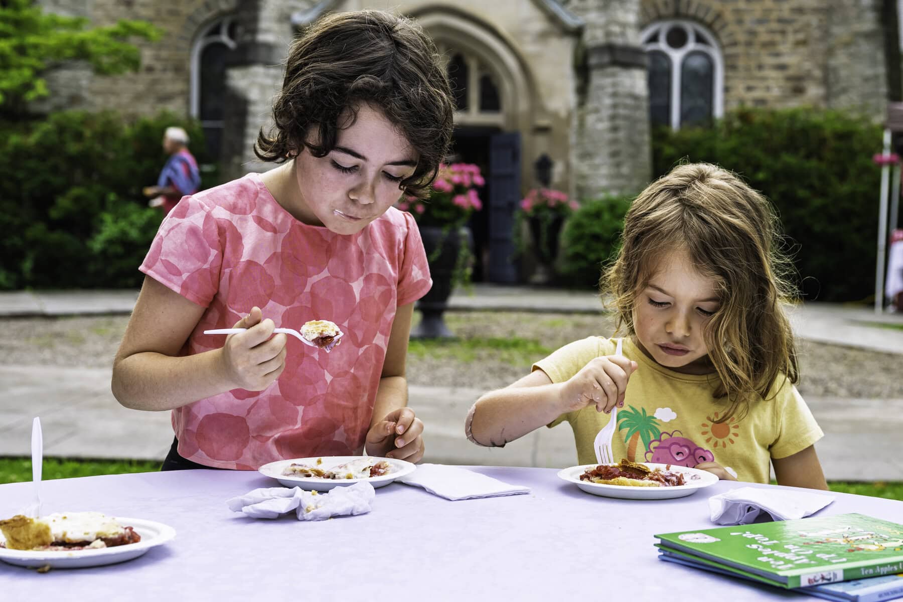 Dig in! Isabel Hainer, 9, and Eloise Hainer, 6, enjoy some cherry pie and ice cream.