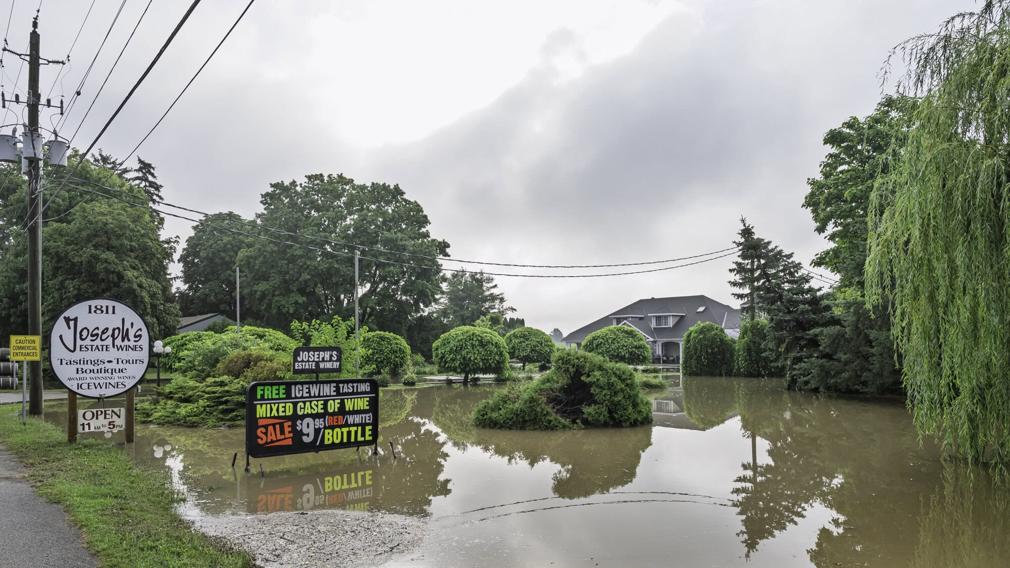 The ditch outside Joseph's Estate Winery on Niagara Stone Road is flooded with water.