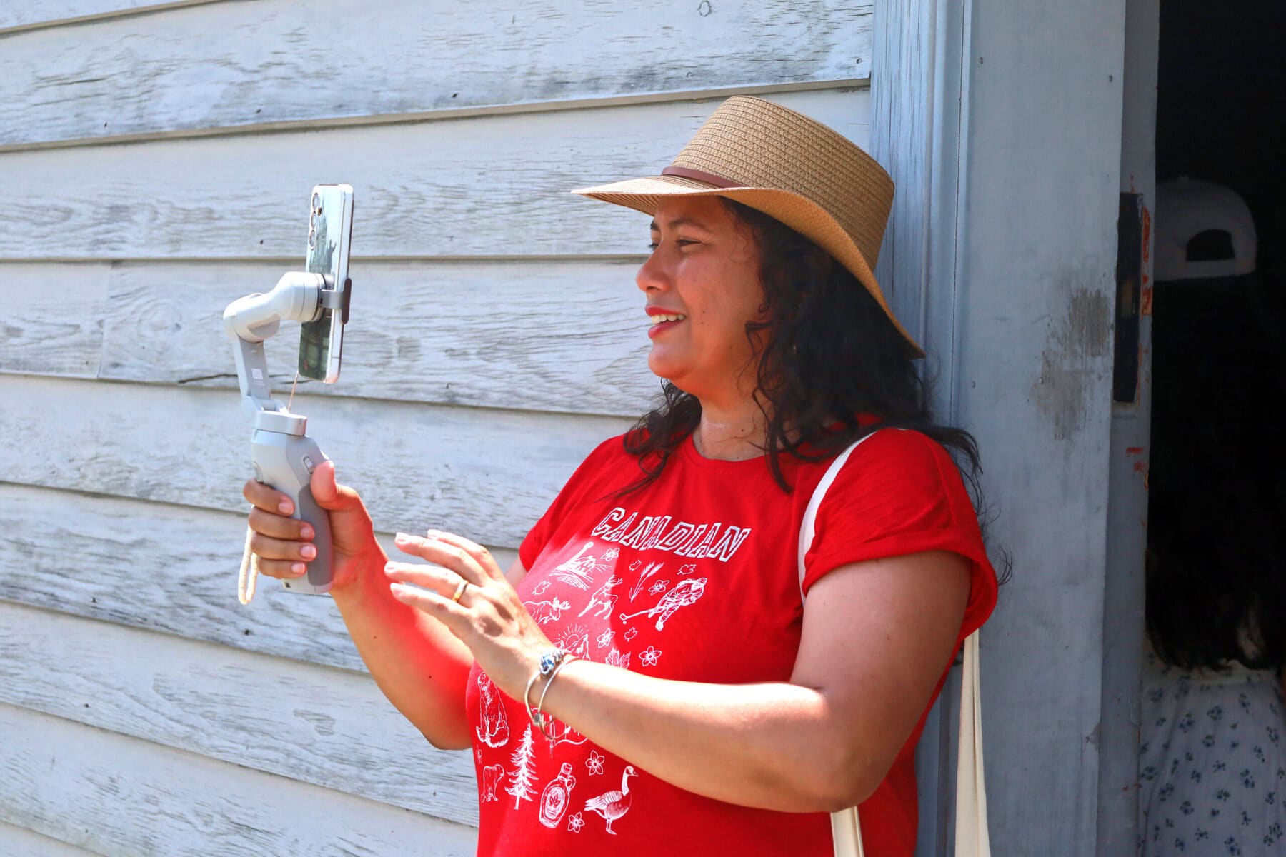 Idania Bolaños, a managing director and tour guide with Vagos’ Travel, livestreams her Canada Day stop at Fort George, sharing what she called Niagara’s “beauty and history” with her travel audience.