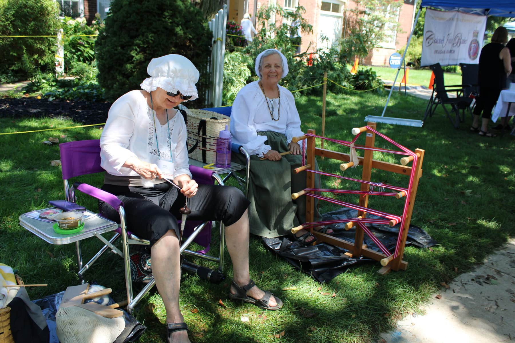 Anna Chandler, left, and Linda Collacott demonstrate traditional weaving at the Niagara-on-the-Lake Museum’s Heritage Festival.