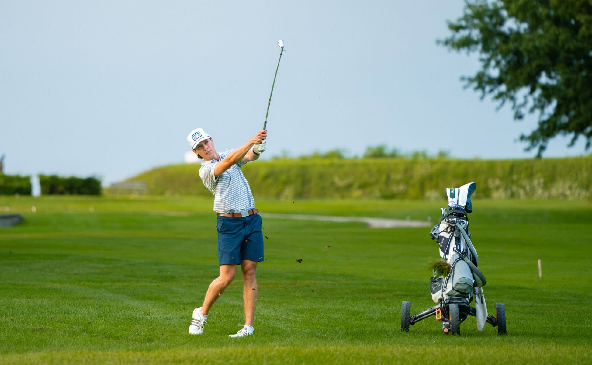 Brendan Meisener hits his approach shot on the 17th hole Sunday. He finished third just eight shots behind Ricky Watson.