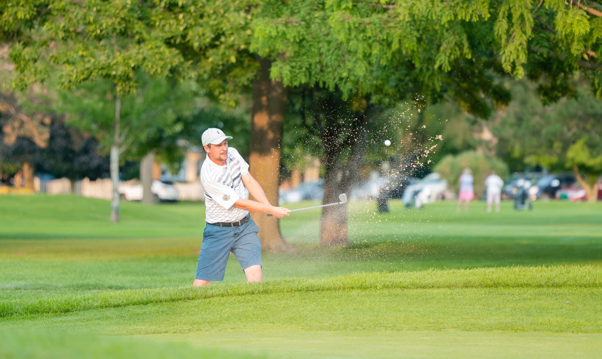 Down by a shot, James Grigjanis-Meusel plays a bunker shot on #17 on Sunday.