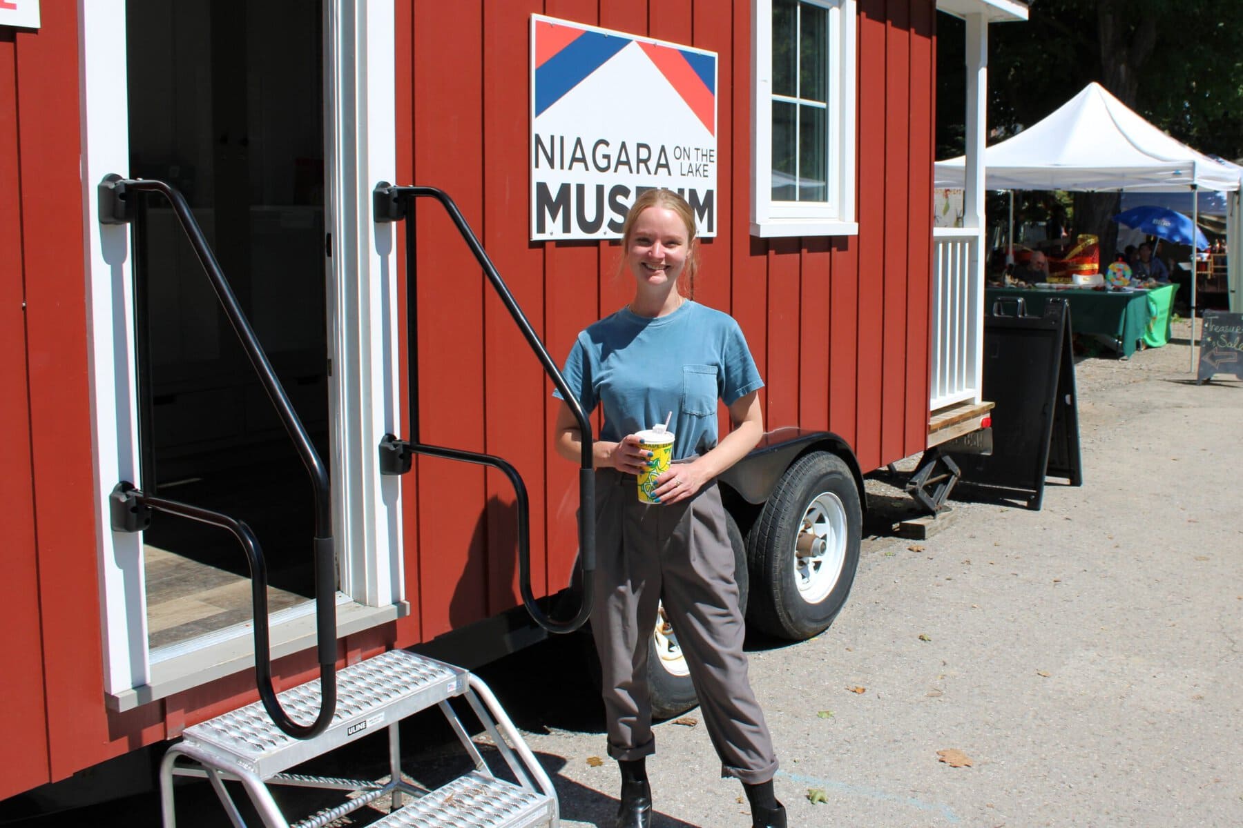 Gwen Anderson, the museum’s educational program co-ordinator and Heritage Festival organizer, stands outside the Tiny Museum exhibit.