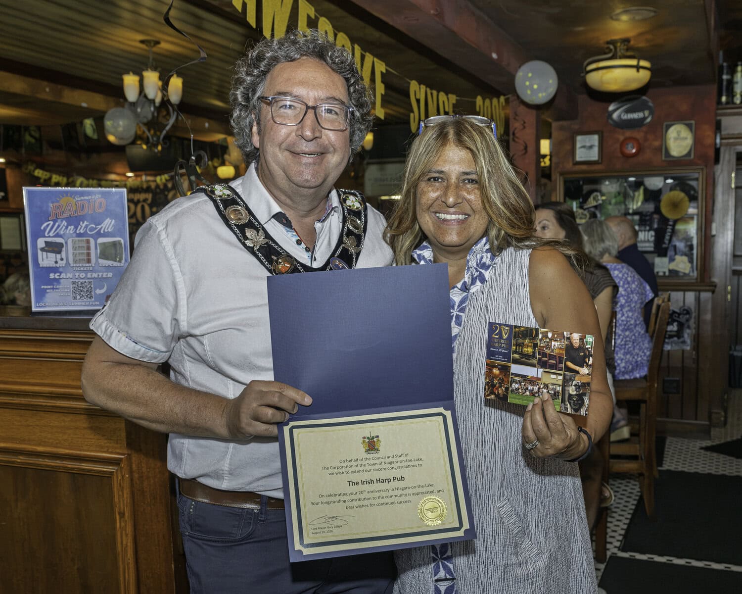 In recognition of the Irish Harp's latest milestone, the Town of NOTL and the lord mayor present Jokie and the Irish Harp with a certificate.