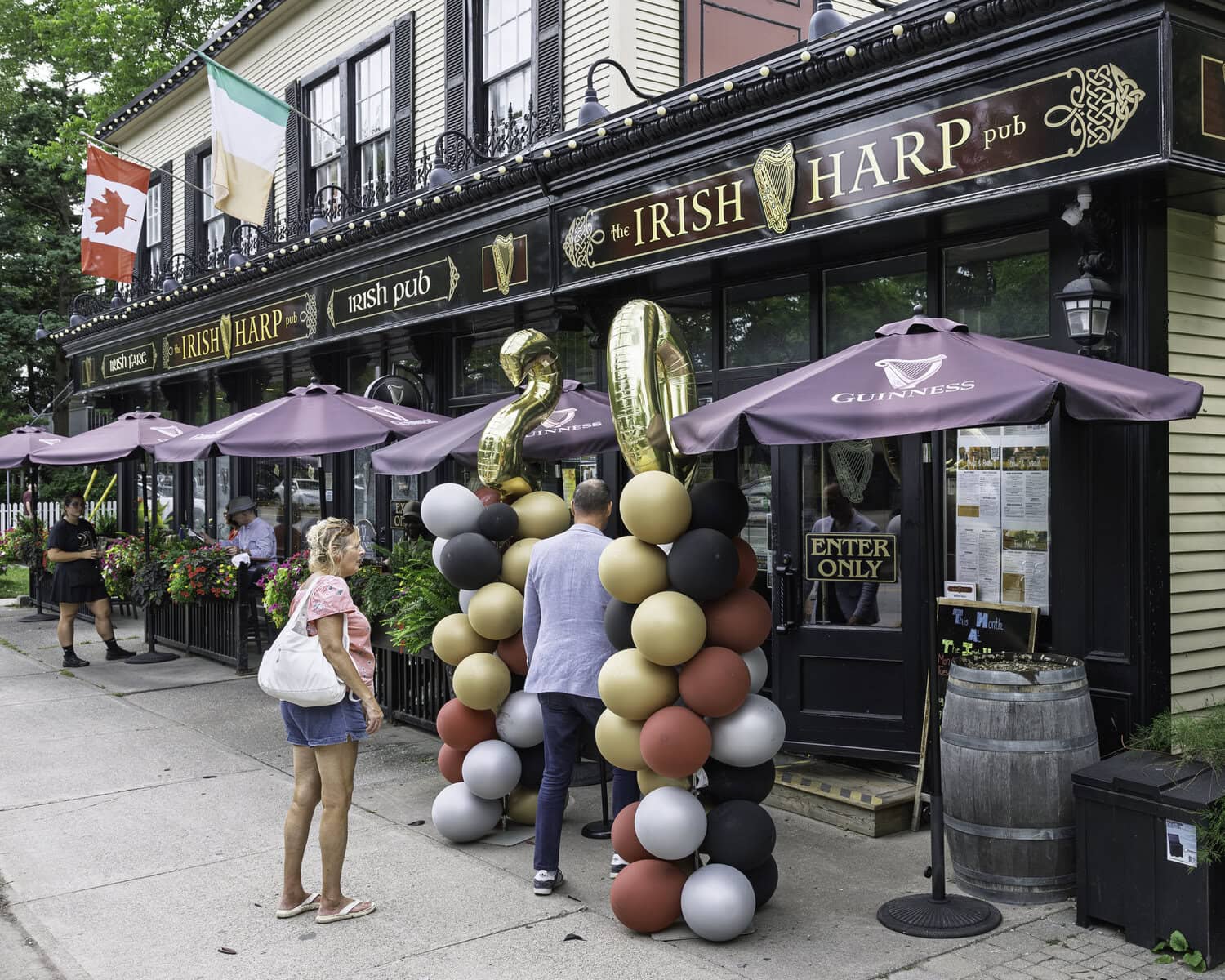 Patrons enter the Irish Harp Pub for its 20th anniversary celebration. The pub has called 245 King St. in Niagara-on-the-Lake home since 2006.