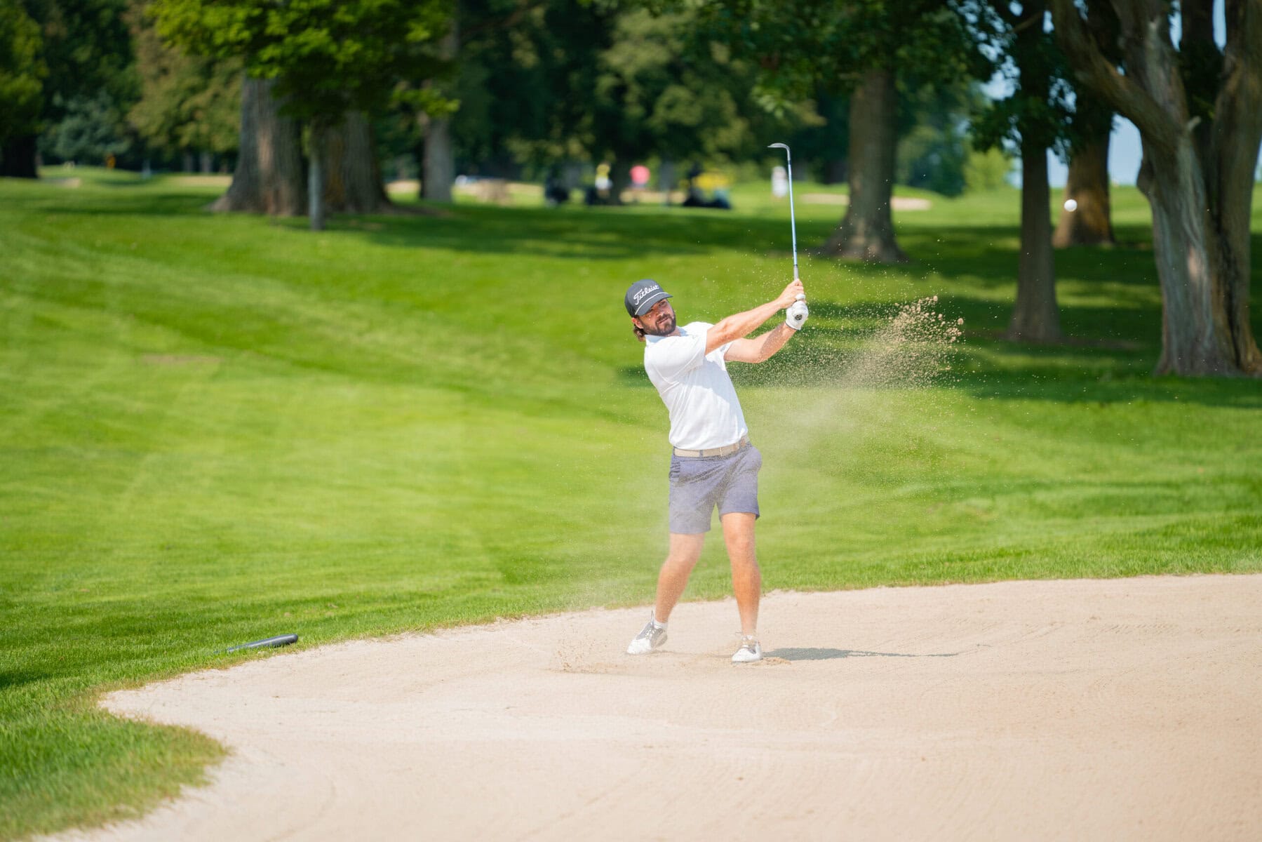 John Vander Hoeven blasts out of the sand.