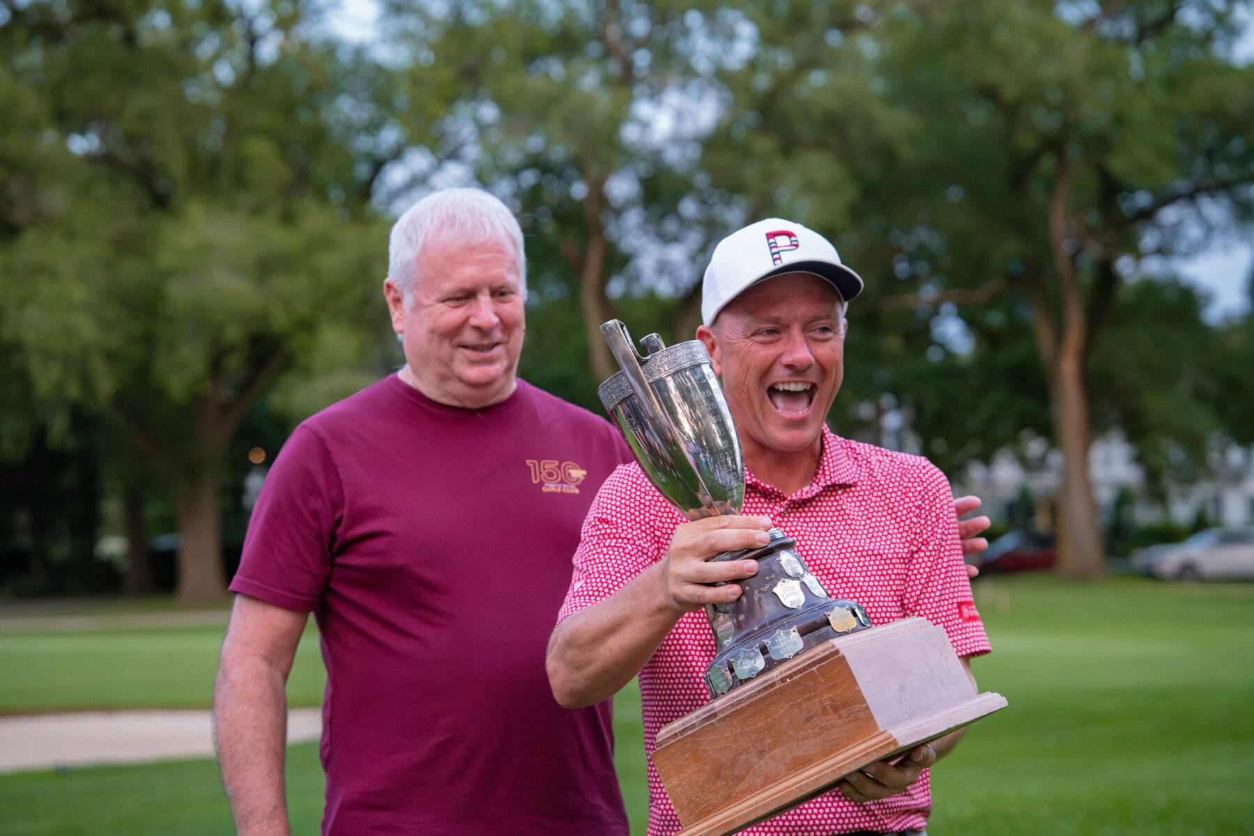 Mark Derbyshire with an ecstatic A.J. Harlond, winner of the men's B flight.