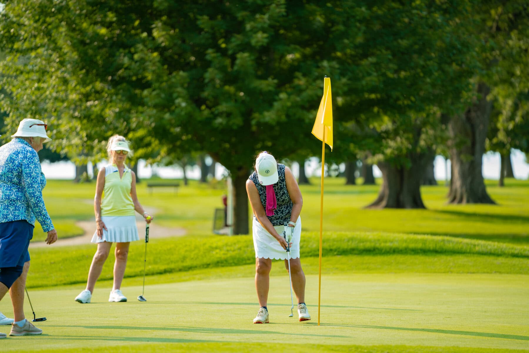 May Chang taps in while Judy Mantle and Shelby Leeder look on.