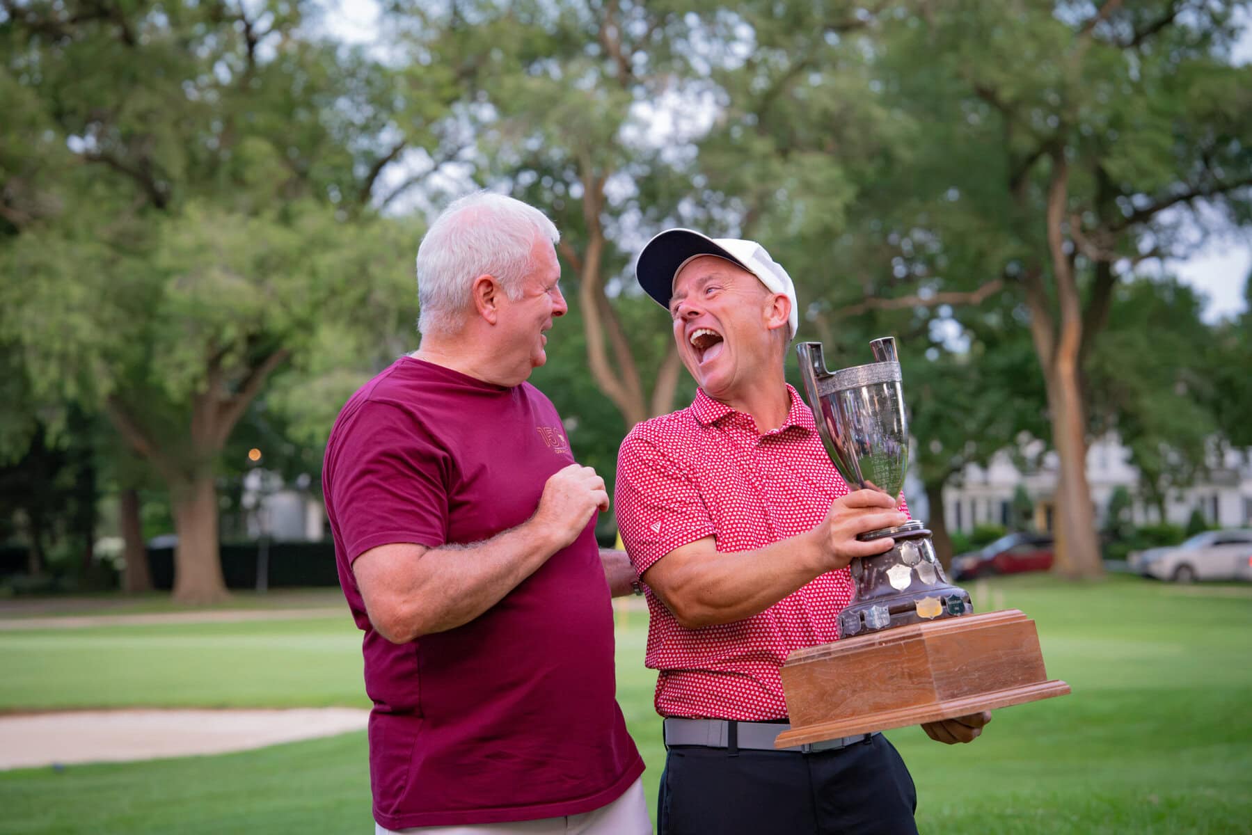 Men's B flight winner A.J. Harlond yuks it up with Mark Derbyshire.