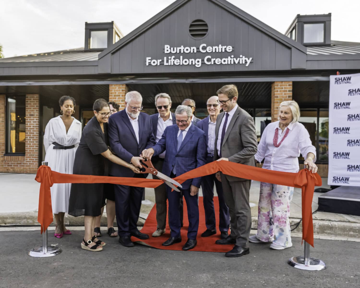 The Shaw Festival's executive leadership team marks the official opening of its Artists' Village, a residence for performers and space for education and outreach programs, at a ribbon-cutting ceremony on Friday, Aug. 14.