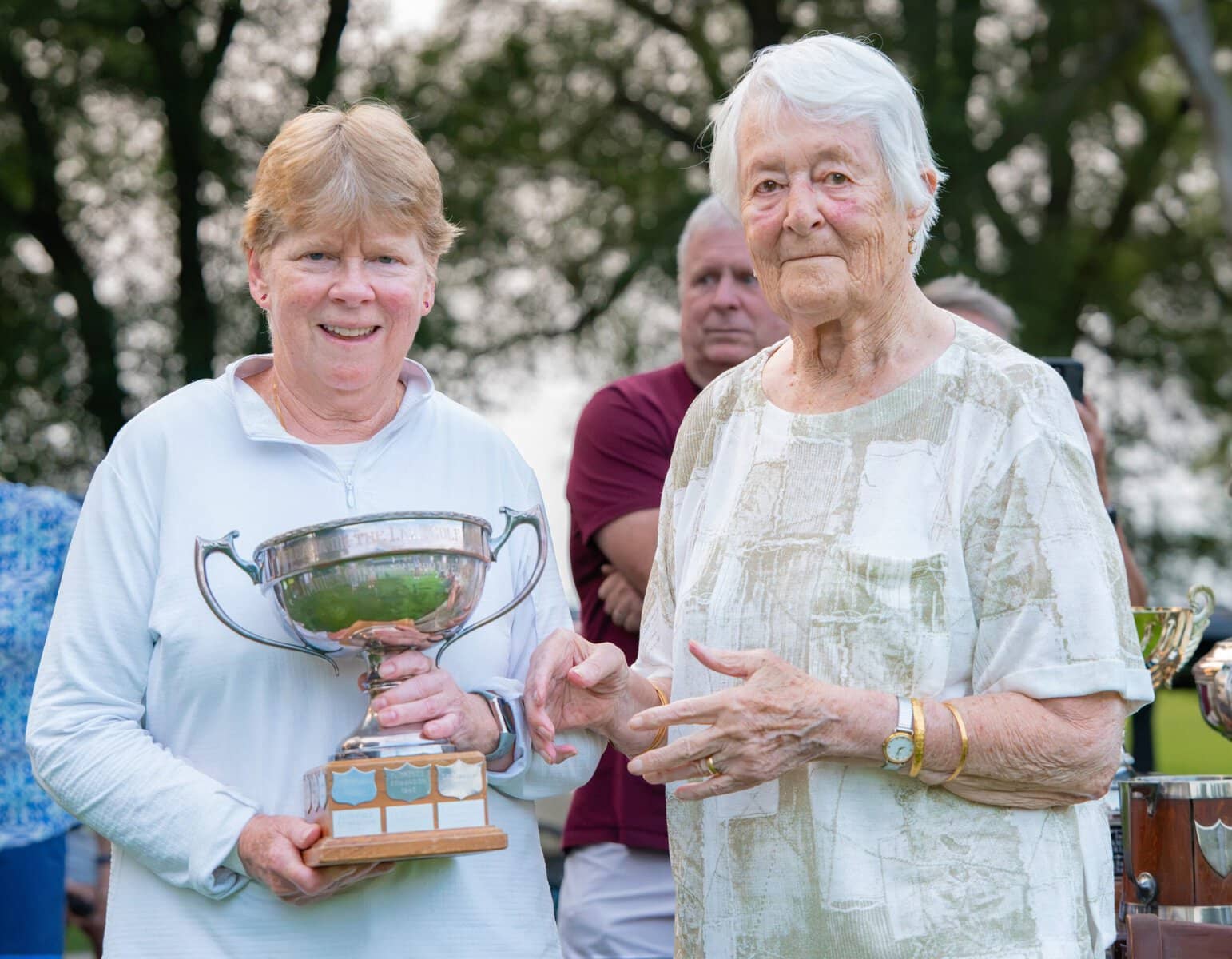 Women's Open winner Diana Dimmer received the championship trophy from Barbara Ahluwalia.