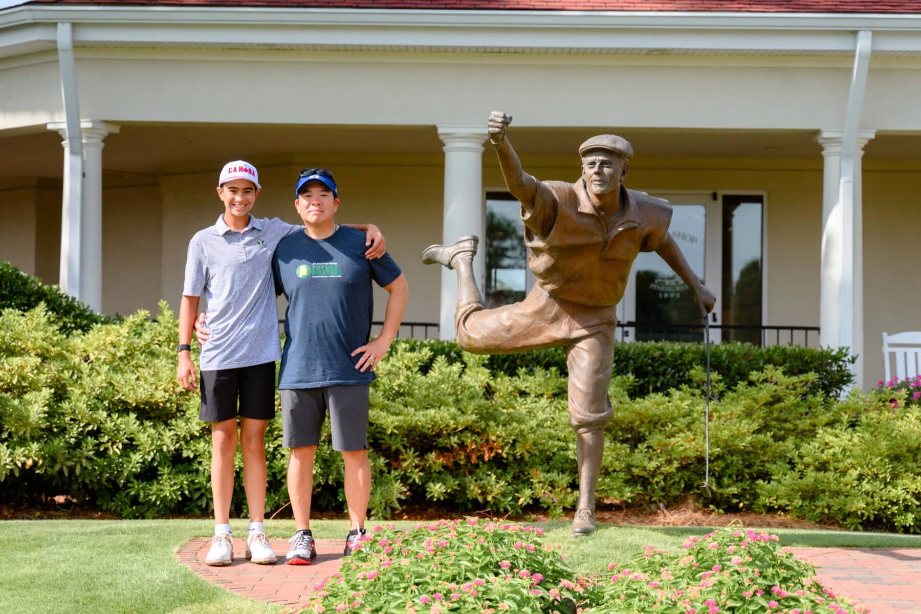 Father and son, Eli Perng with dad Richard and the Payne Stewart memorial at Pinehurst Resort in North Carolina. 