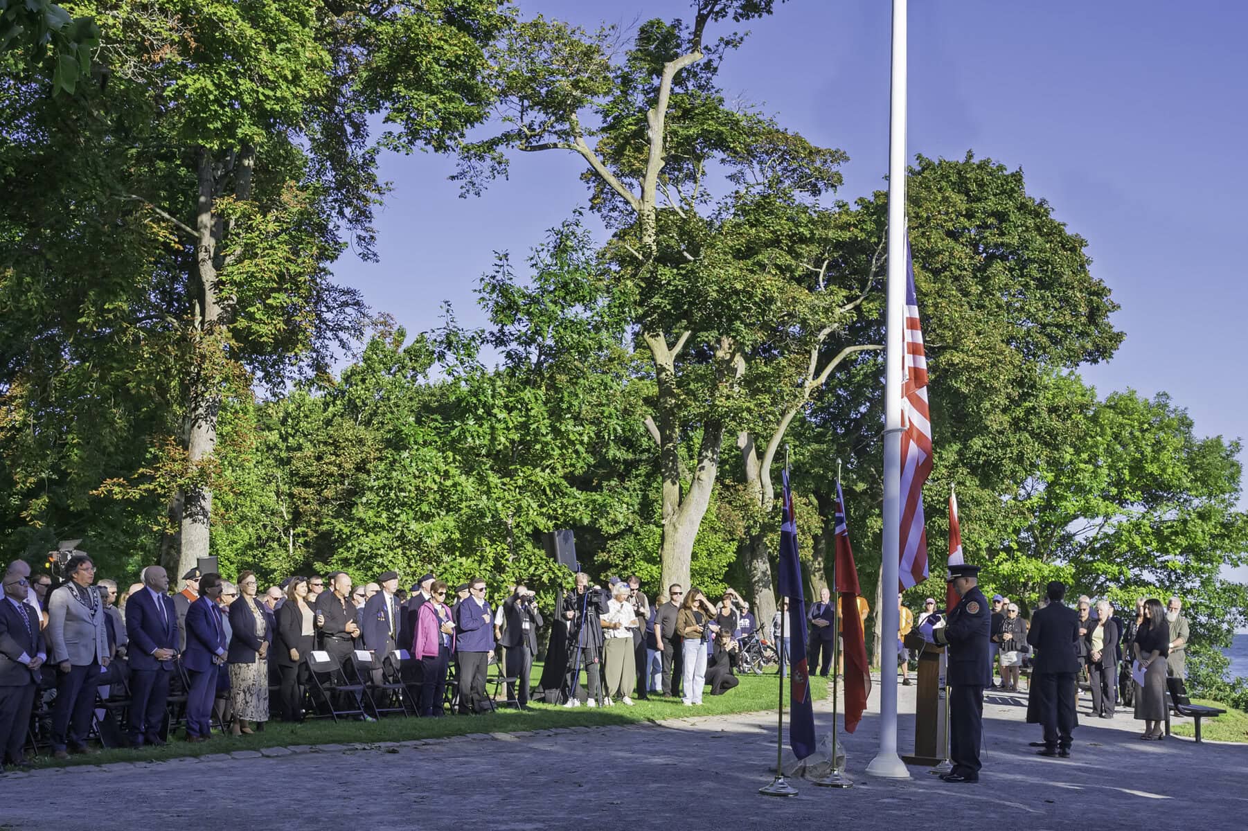 The American flag is attached to the flagpole at Queen's Royal Park and flown high as part of Niagara-on-the-Lake's 9/11 commemoration ceremony.