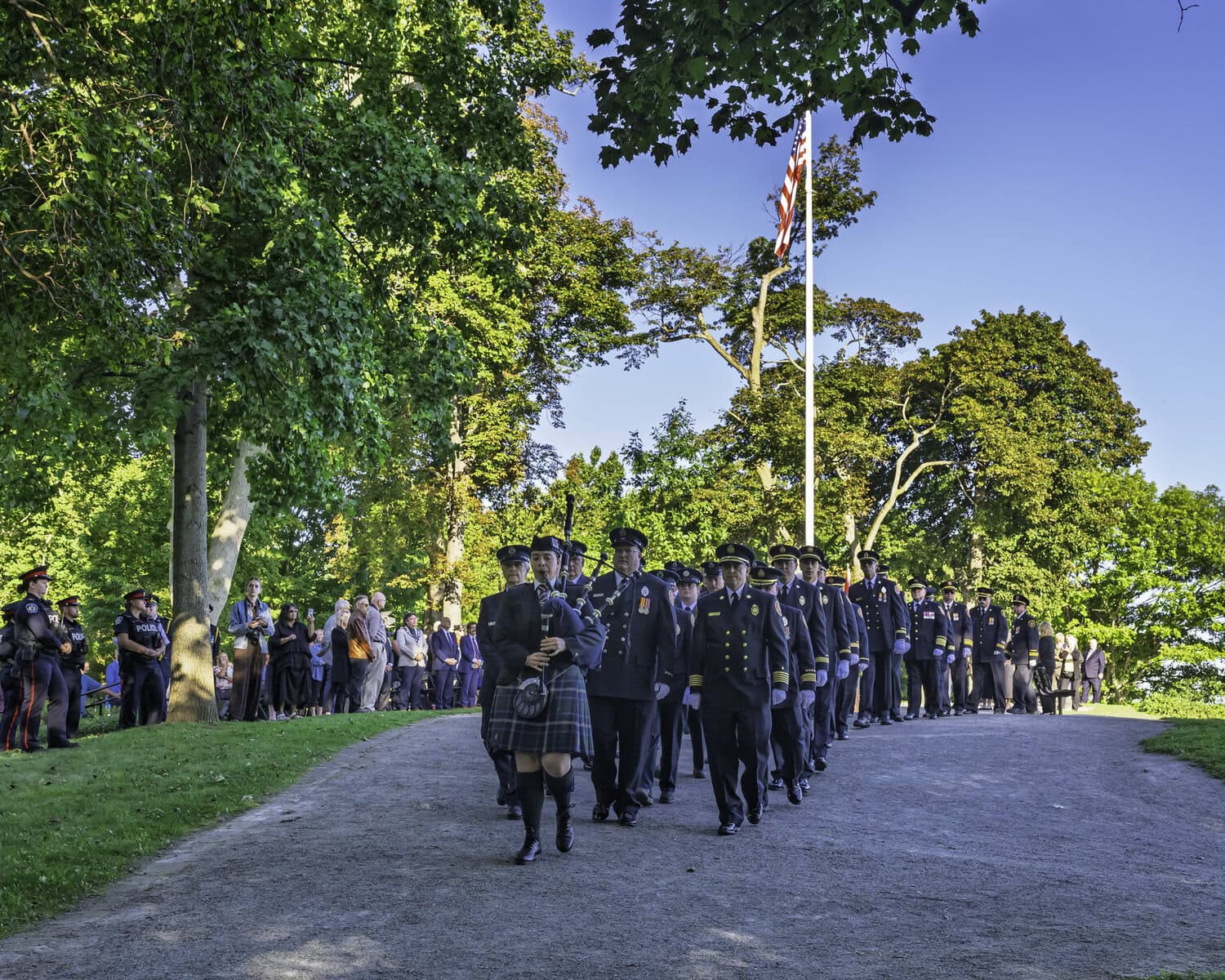 Canadian and American first responders make a solemn procession through Queen’s
Royal Park on the morning of Friday, Sept. 11, to commemorate 25 years since the deadly
terrorist attacks on U.S. soil that killed thousands of people. 