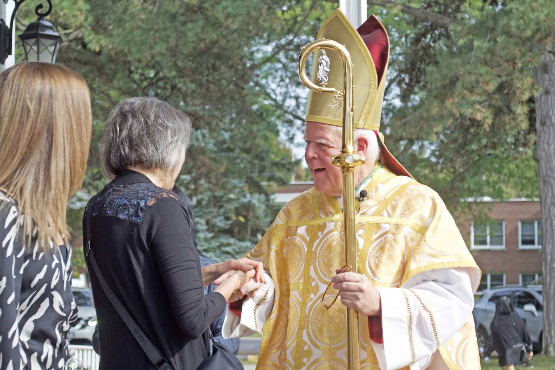Bishop Gerard Paul Bergie greets parishioners after the celebratory mass.