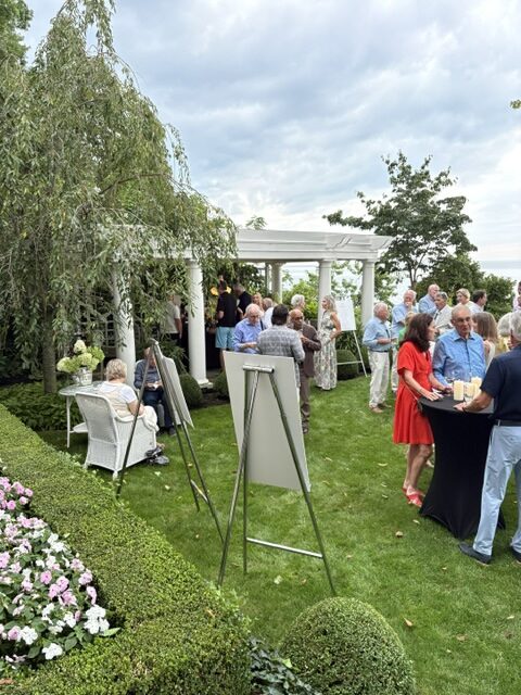 Guests gather in the garden during the Heritage Trail fundraiser, which sold out in just three days.