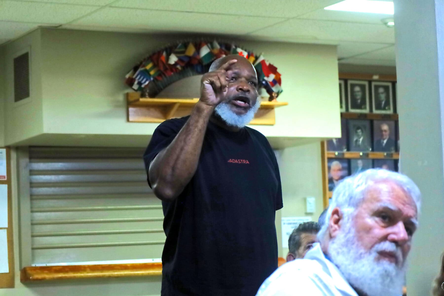 St. Davids resident Reginald Huggins demands answers from municipal candidates during Wednesday’s debate after sewage backed up into his Millpond Road home three times in two years.