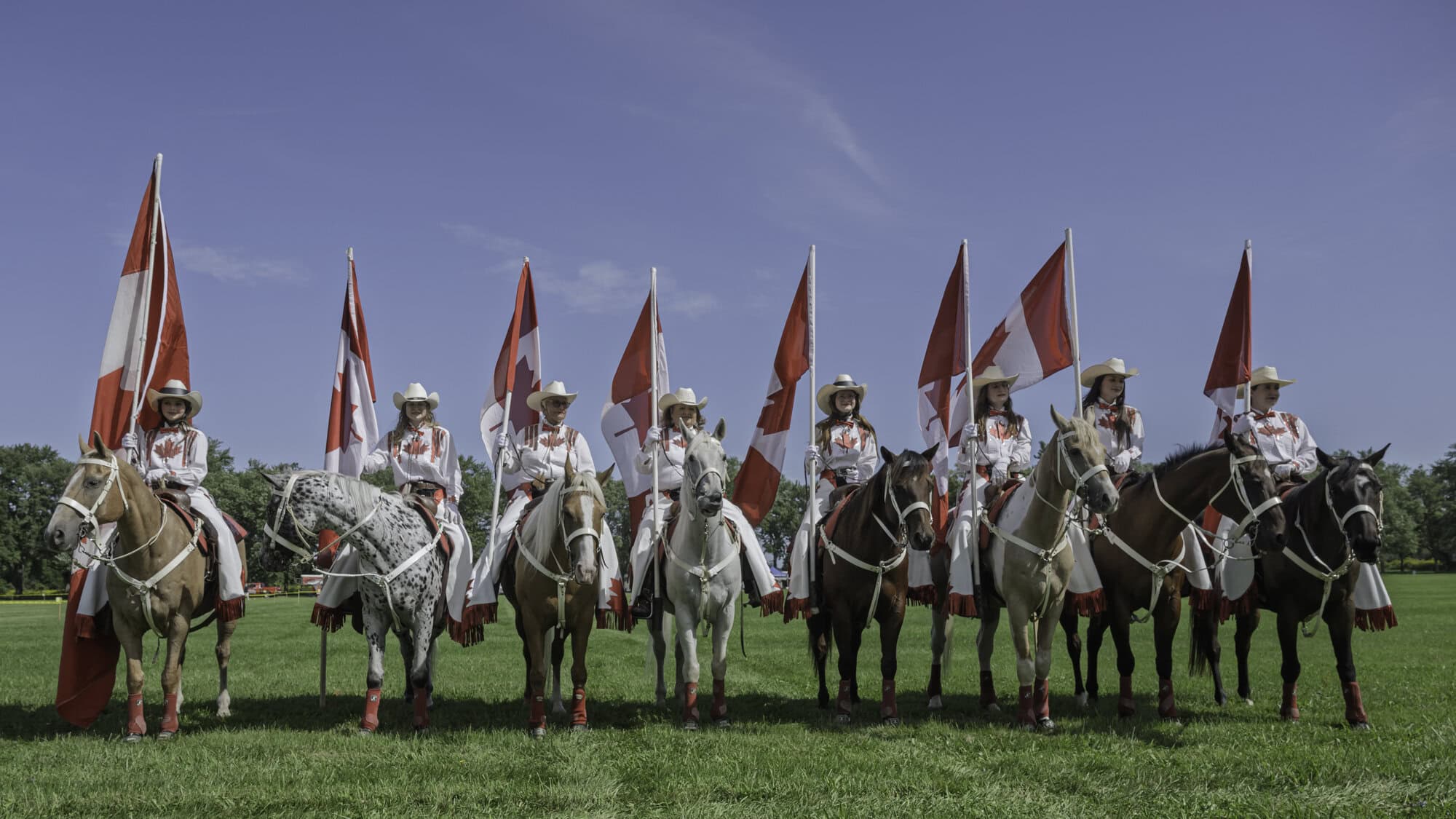 The Canadian Cowgirls stand tall on the Commons as the opening ceremony kicks off. They're a precision equestrian drill team that tours across North America.