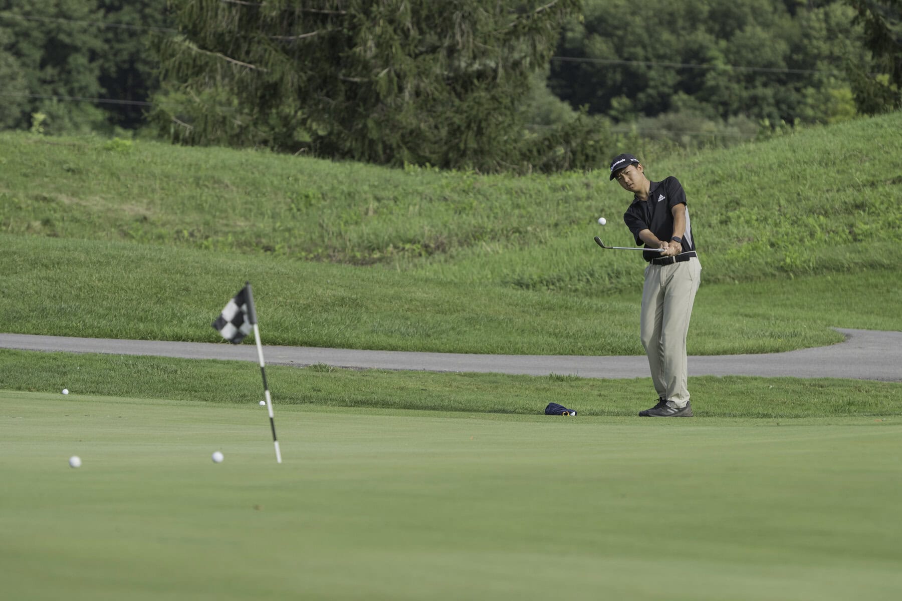 Chipping can save a golfer a lot of strokes around the green so Kaige Zhu works on his short game. 
