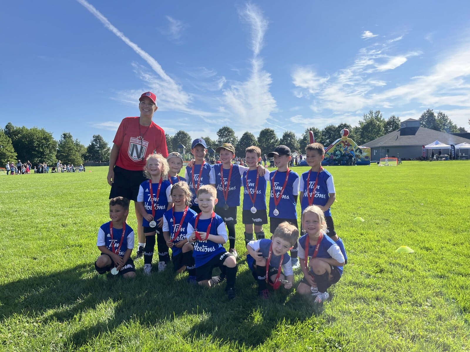 The Niagara-on-the-Lake Soccer Club celebrates another season of fun and teamwork at its closing festival on Saturday. Club president Julia Friesen is all smiles on the field with the players who make up the Timbits Blue Ninjas: Julian Zappitelli, Briar Preston, Layla Taylor, Jack Doyle, Drew Blythe, Jade Fowler, Brooks Sherwin, Austin Neufeld, Miles Bowie, Max Greenside, Cole Houtby and Lennox Pena.
