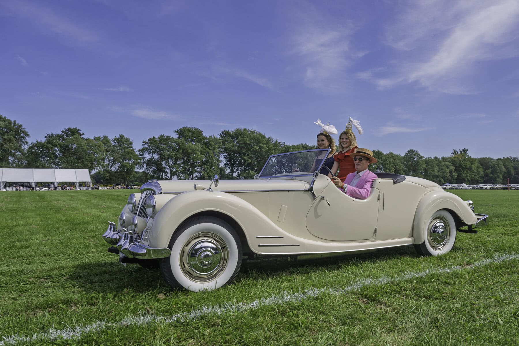 The Yoxall family shows up in style to the NOTL polo jamboree: adorned in their best late-summer attire and rocking their fanciest hats, they take in the scenery at the Commons in this vintage ride (featured in the event’s car show). 